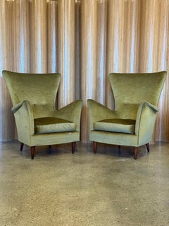 Pair of Italian olive velvet wing back lounge chairs in the style of Gio Ponti