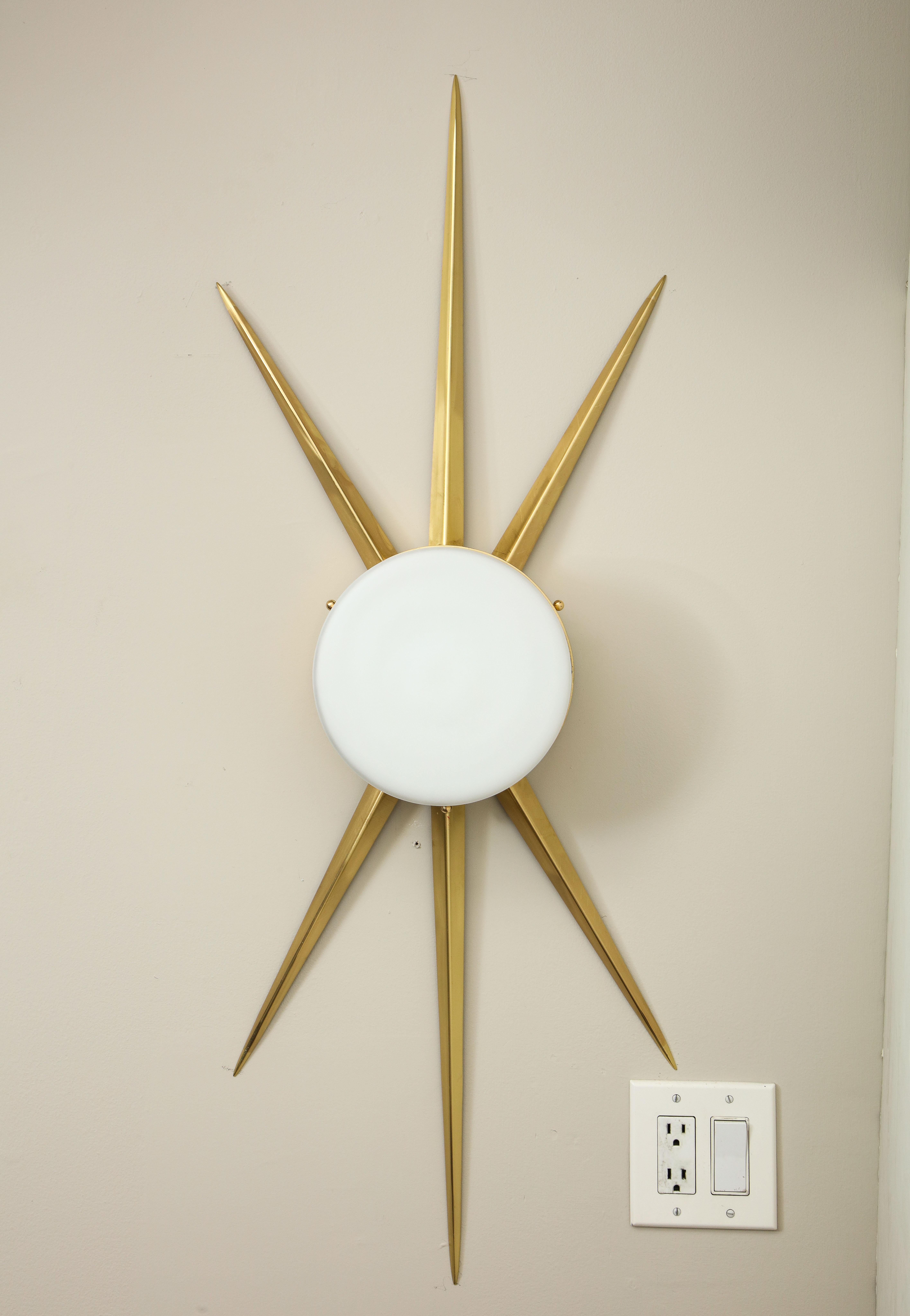 This pair of brass and opaline glass sconces are available for custom orders. The size of arms can be made in different length.