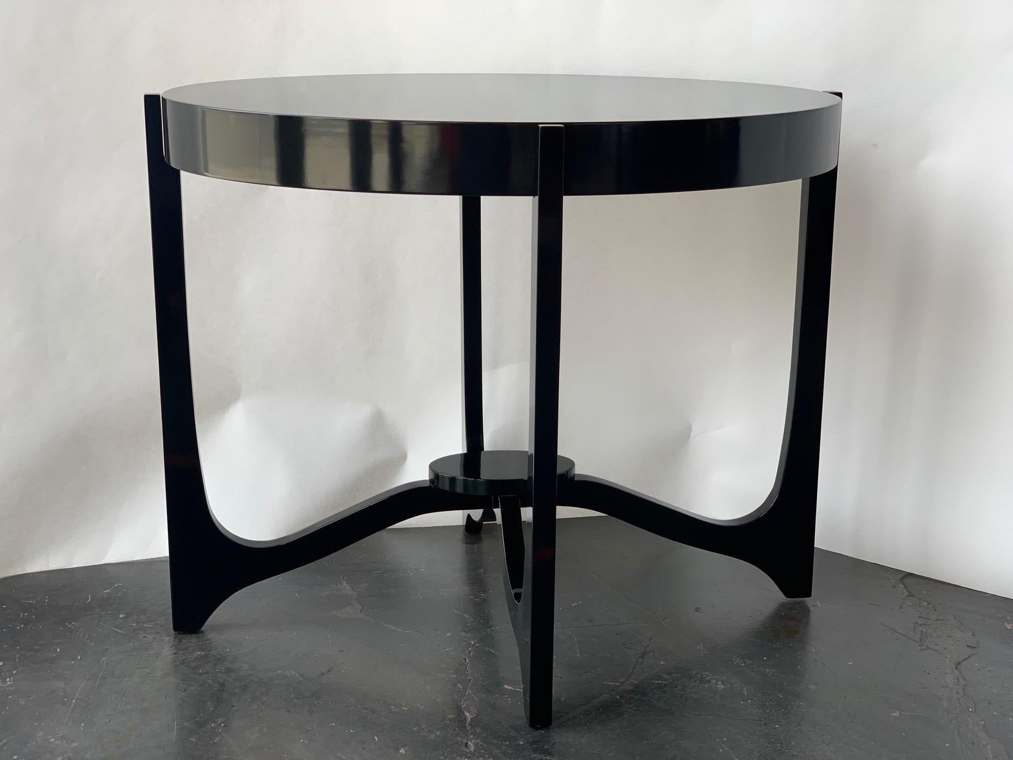 Pair of Italian oval side tables in black lacquer, Italy, 1980s.