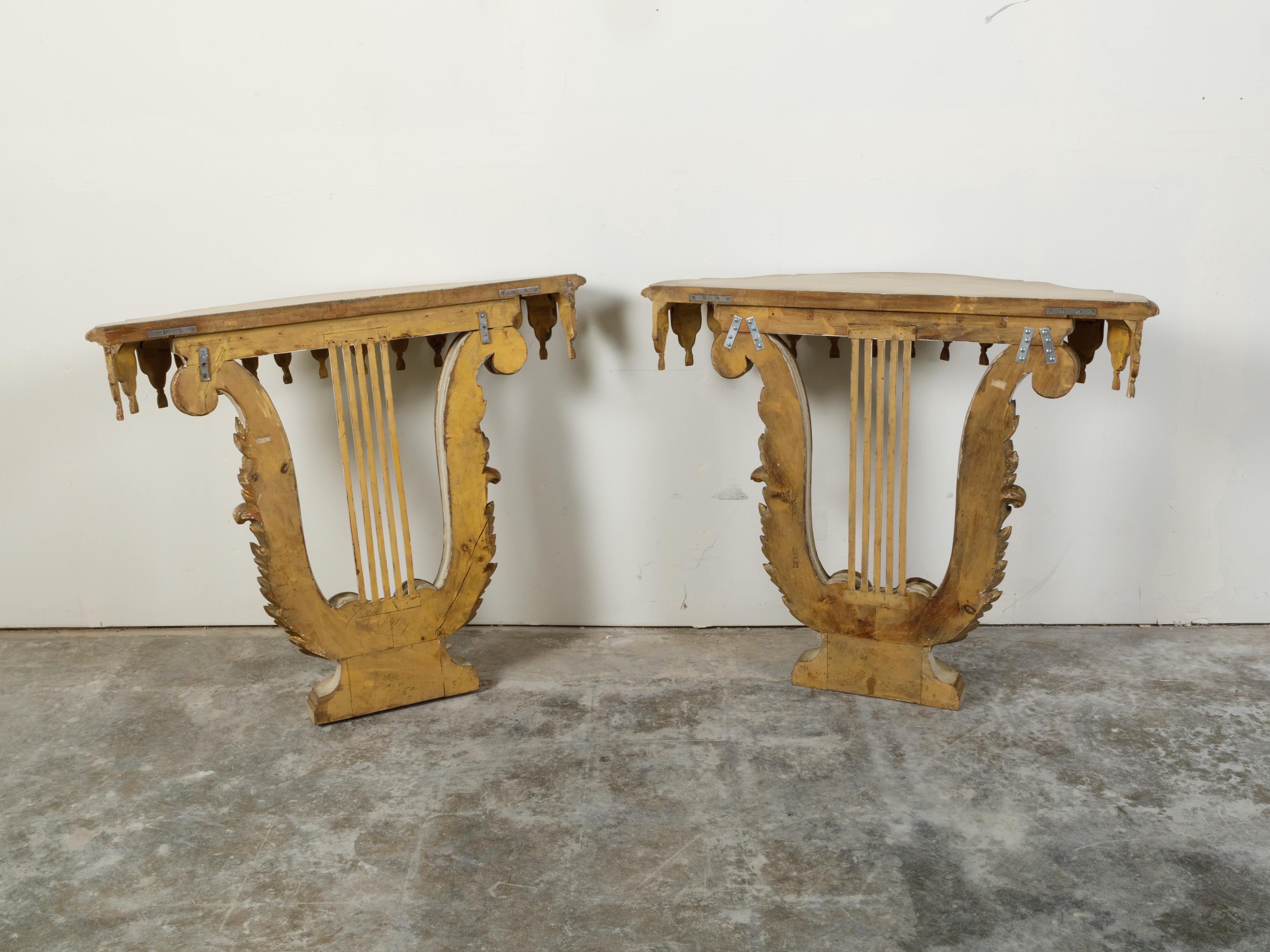 Carved Pair of Italian Painted and Gilded Demilune Console Tables with Lyre Bases For Sale
