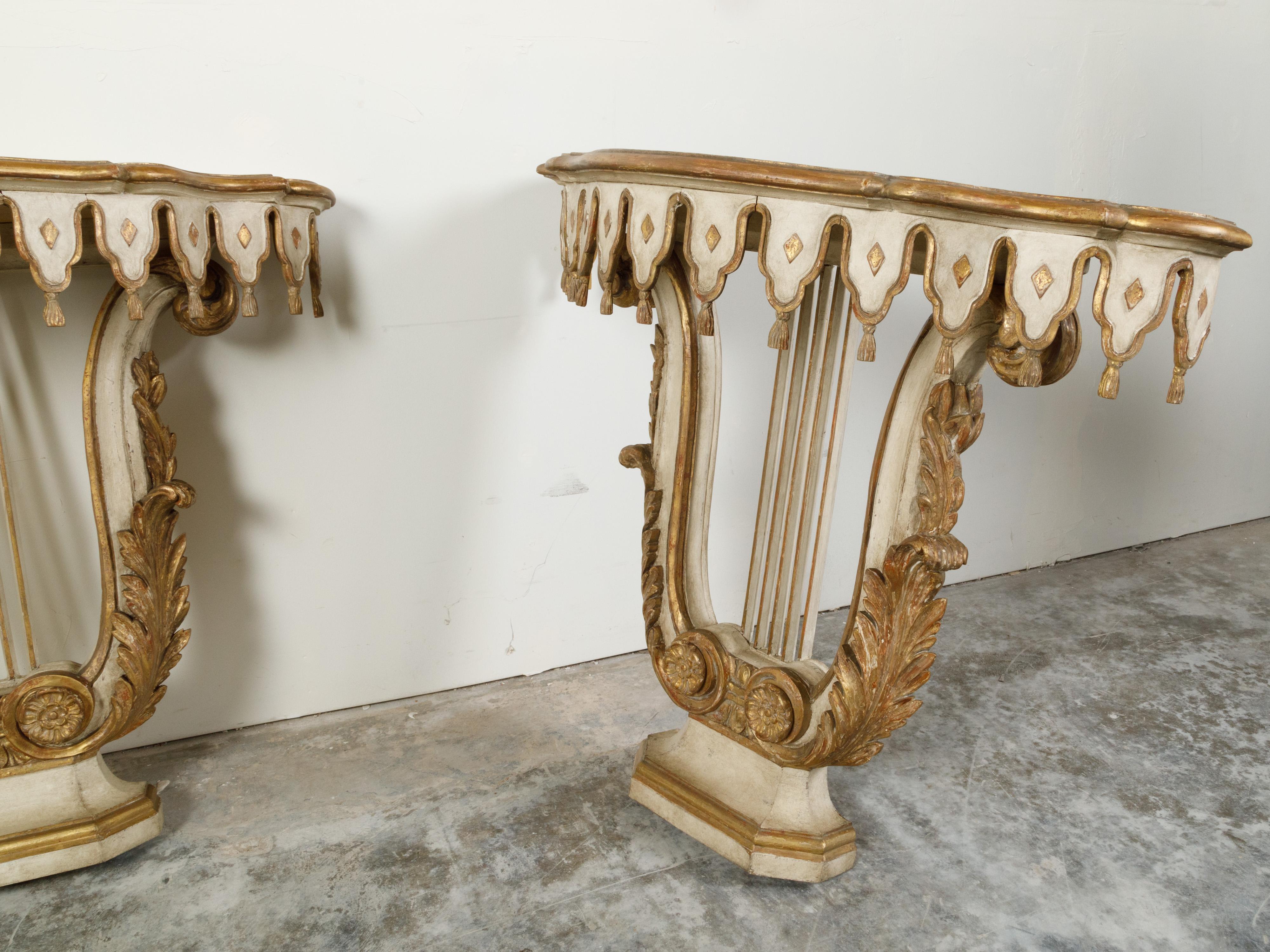 Wood Pair of Italian Painted and Gilded Demilune Console Tables with Lyre Bases For Sale