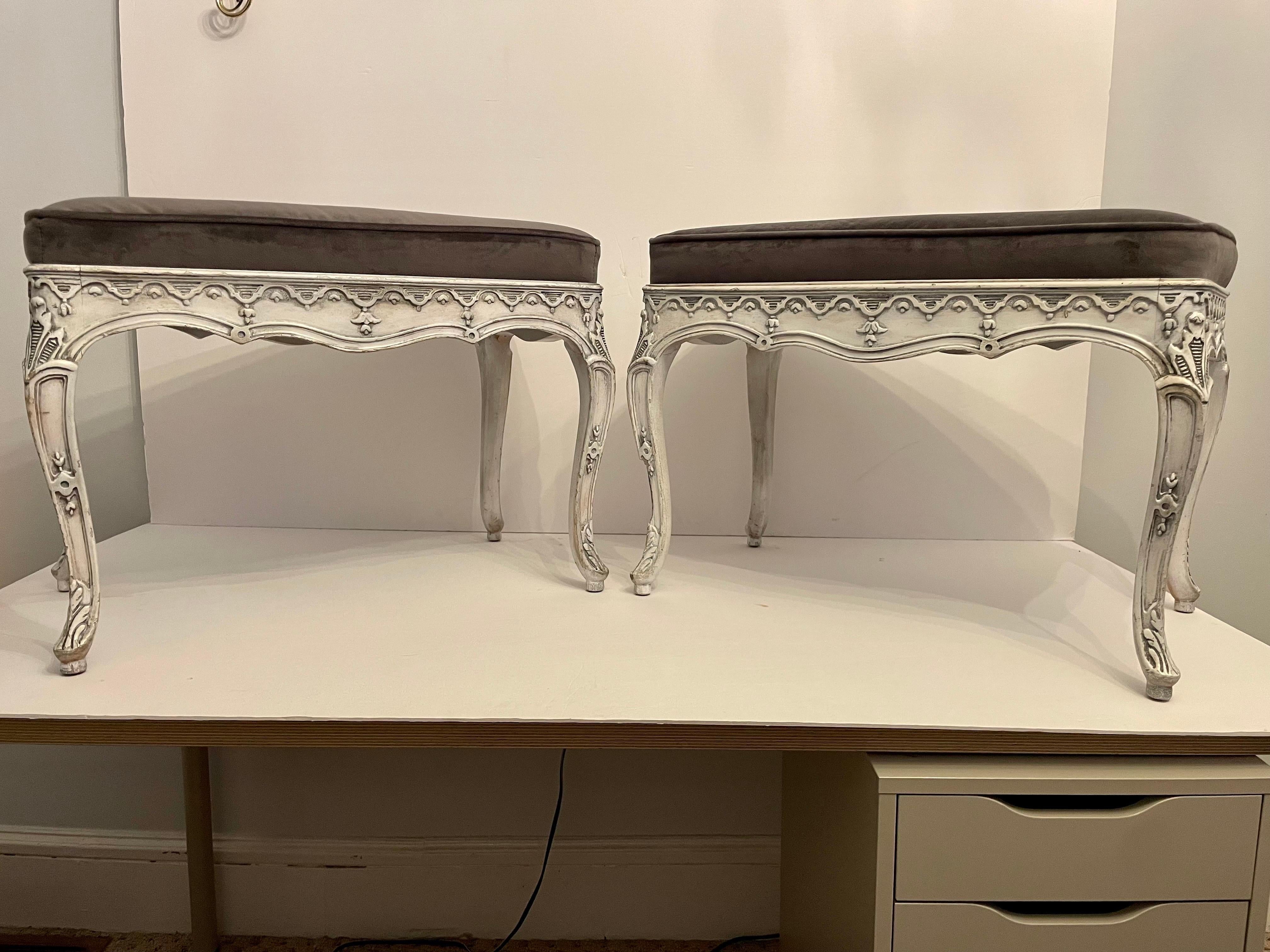 Pair Of Italian Painted Benches. Newly upholstered in charcoal velvet. Each measures 24.5” wide x 14.75” deep x 18.75” tall. Benches were repainted at some point. These can be professionally packed and shipped, price depends on location.
