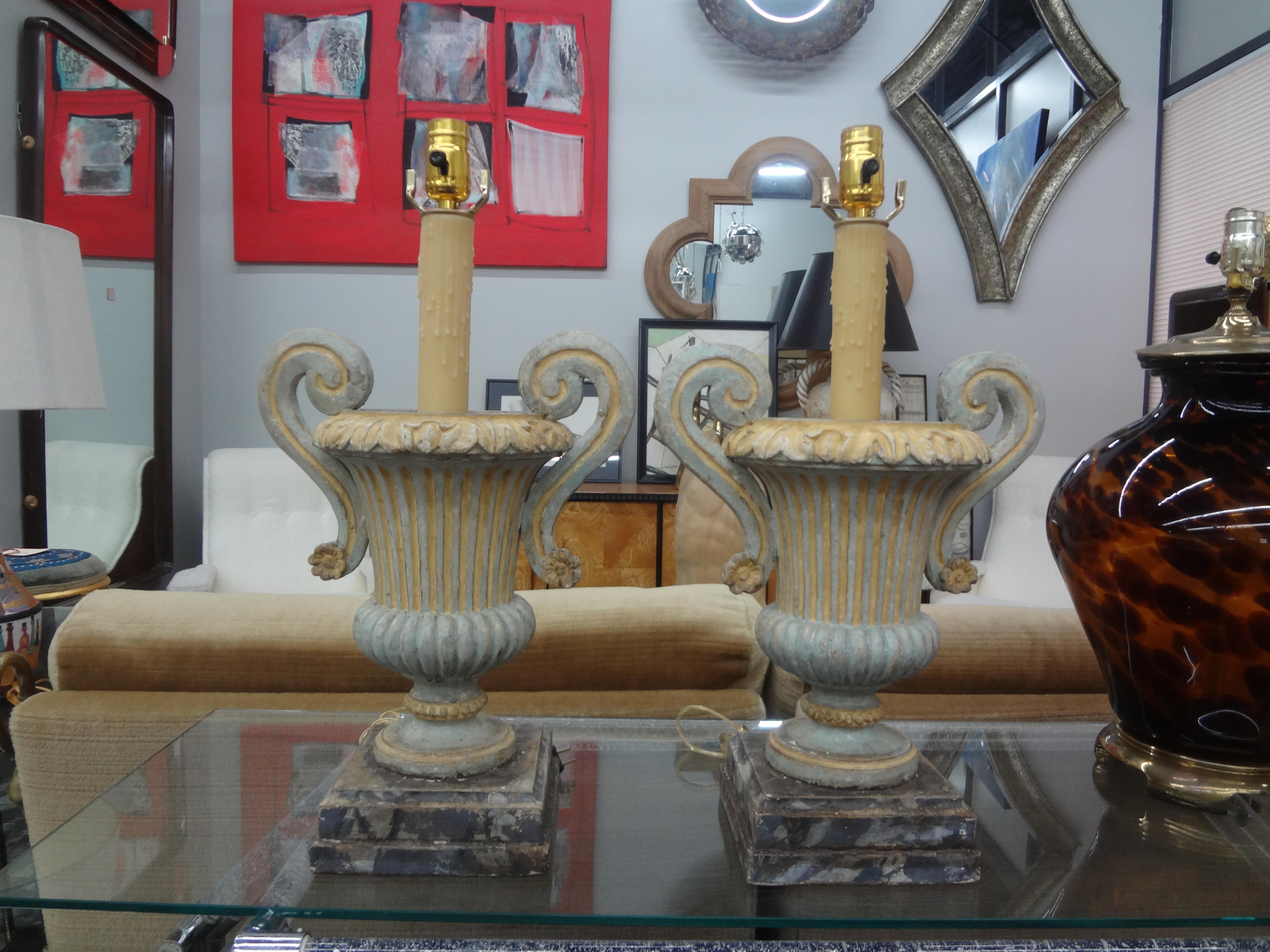 Pair of Italian painted urn form lamps.
Stunning pair of Italian painted or polychrome urn form lamps on faux marble bases that date to the 1920s.
This lovely pair of Italian Baroque style lamps have been newly wired with new sockets for the U.S.