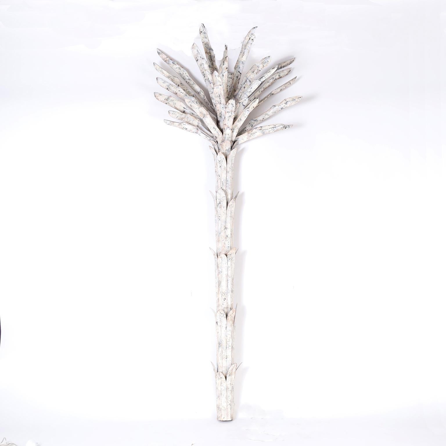 When is a floor lamp a sconce? When it is 94 inches tall and attaches to the wall. These palm trees are crafted in metal with perfectly distressed paint and a chic sculptural form.