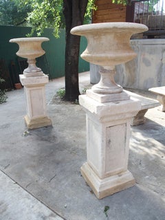 Pair of Italian Patinated and Distressed Cast Stone Vases on 3-Piece Plinths