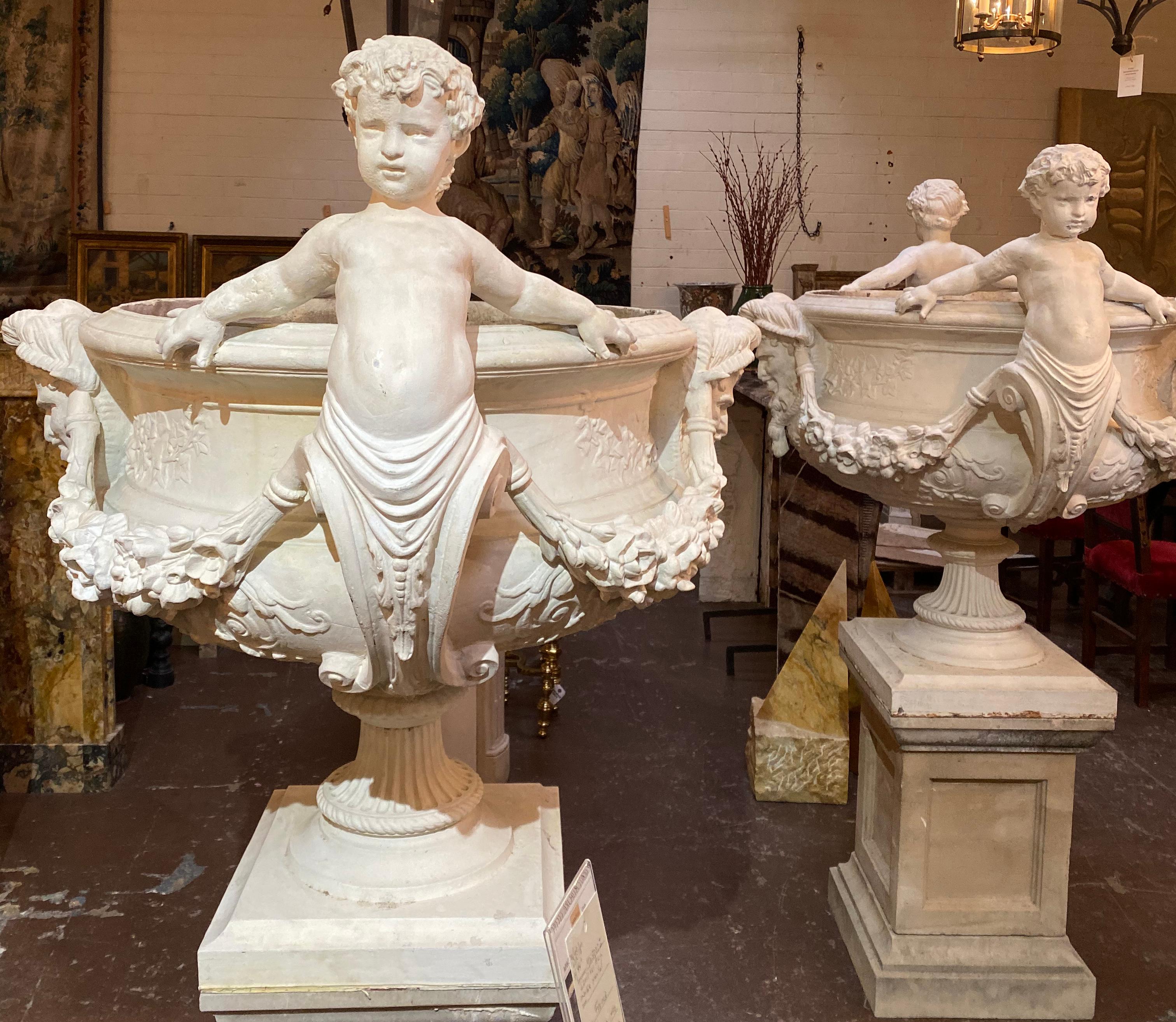 These grand statues function as planters, and originate from Italy, circa 1850s. Planters sold as a pair, bases in photos optional to purchase.

Measurements: 46