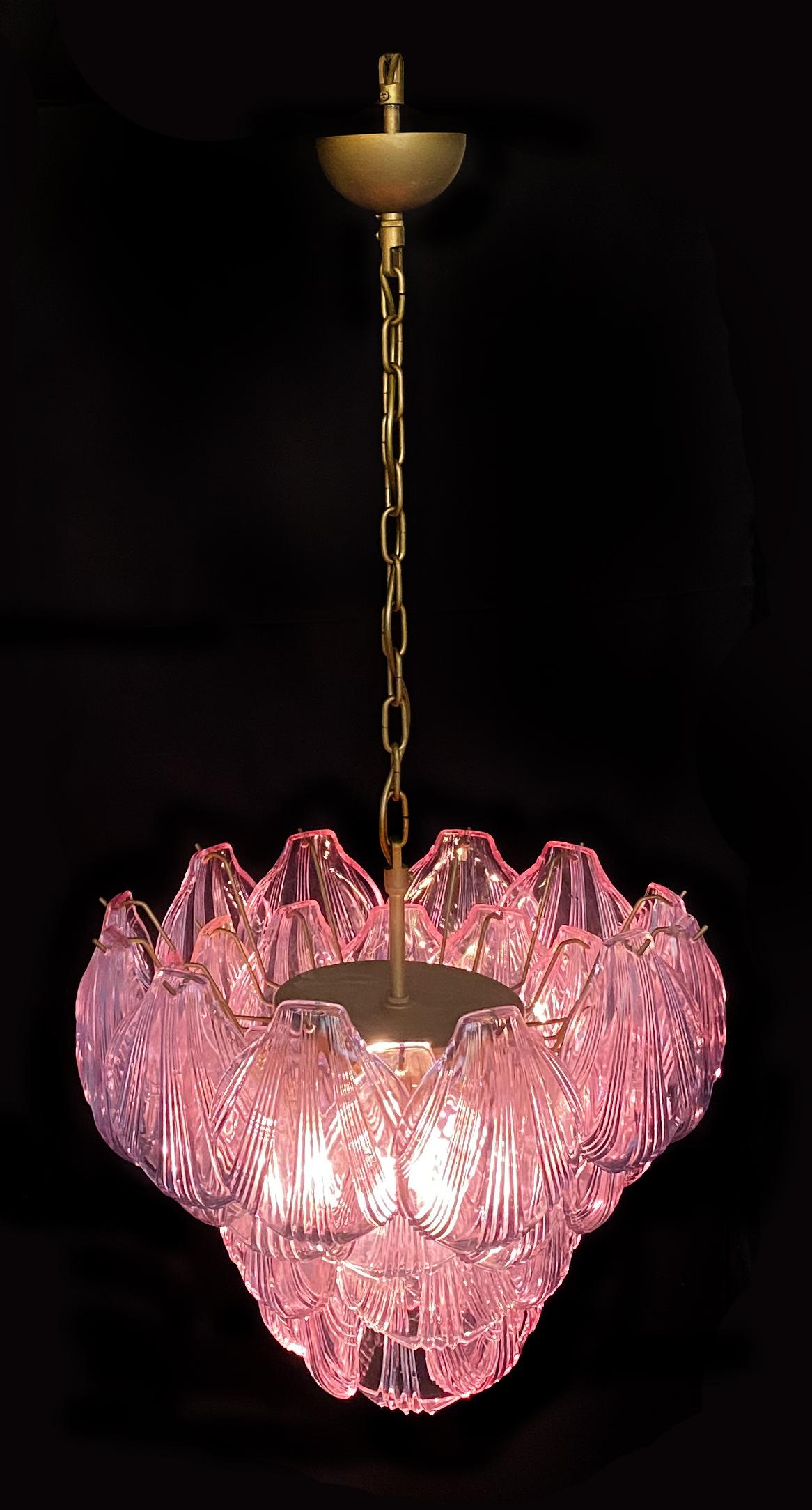 Fantastic pair chandeliers with pink a glasses, gold painted metal frame. It has 36 shell glass. The glasses are very high quality, the photos do not do the beauty, luster of these glasses.
Period: Late 20th century
Light bulbs: 7 light bulbs E 27