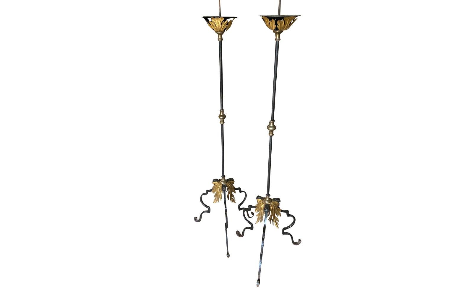 An outstanding 18th century pair of Pique Cierge from the Veneto region of Italy.  Masterly crafted from hand forged iron with gilt accents.  A very elegant accent for a lovely surrounding.