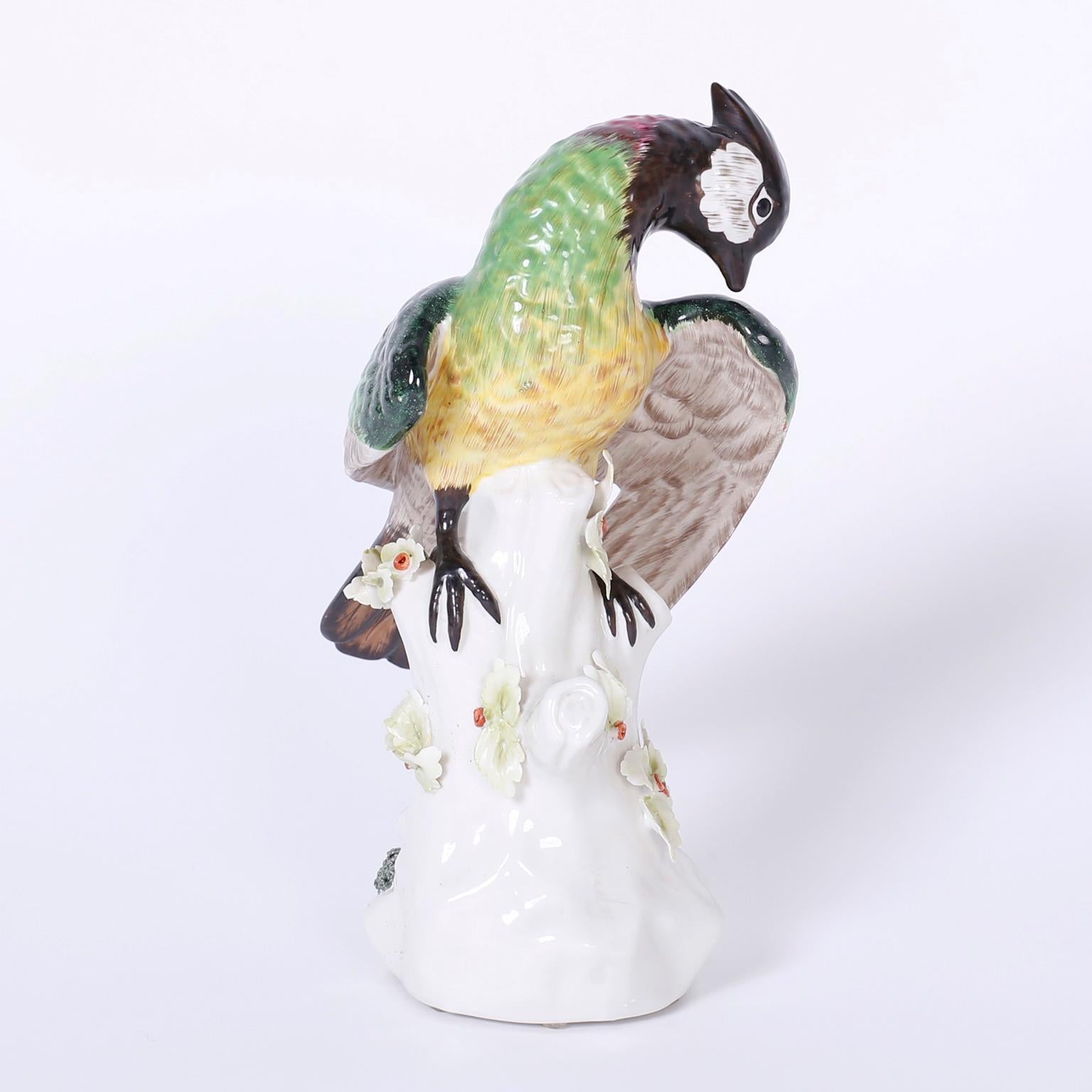 Fine pair of porcelain parrots with matching quizzical expressions and
colorful plumage, perched on blanc de chine tree trunks. Signed Italy on the bottom.