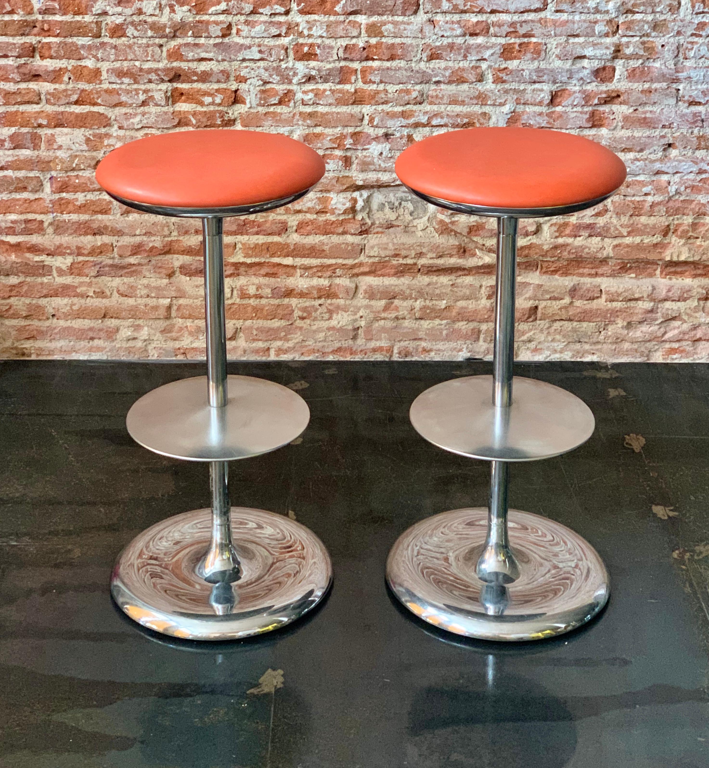 Set of two Italian Postmodern bar stools from late 20th century by Plank. Made in chromed stainless steel and orange leather seats.
Labeled and numbered by the maker.