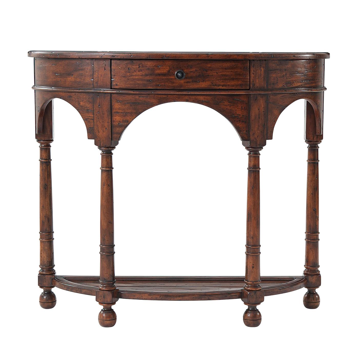 An Italian Provincial antiqued wood bowfront console table, the bowed frieze drawer above arched aprons, turned supports and feet, joined by an under tier. 

Dimensions: 44