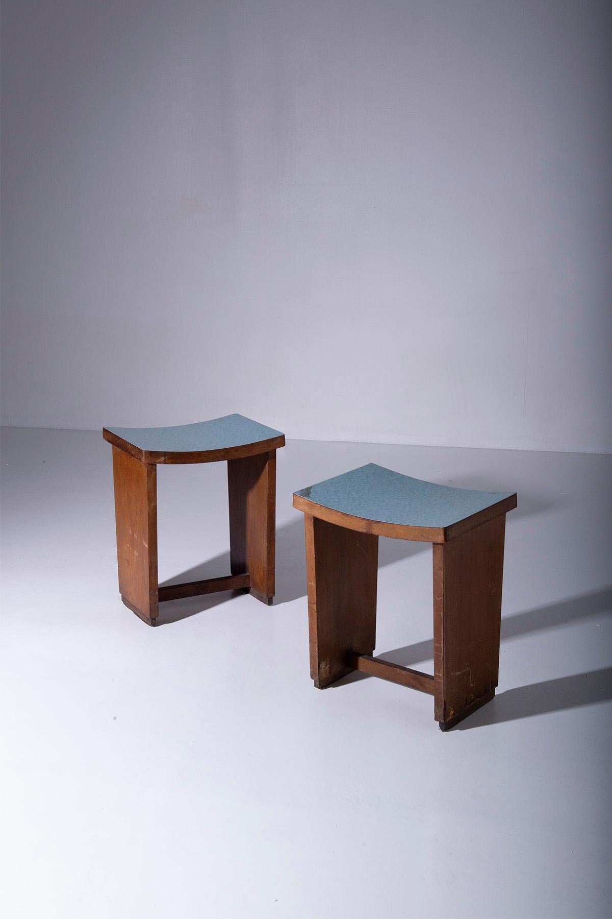 Imagine a pair of Italian rationalist stools, frozen in time from a bygone era. These stools are more than just furniture; they are a testament to a design movement that celebrated precision, simplicity, and functionality.

The first thing that