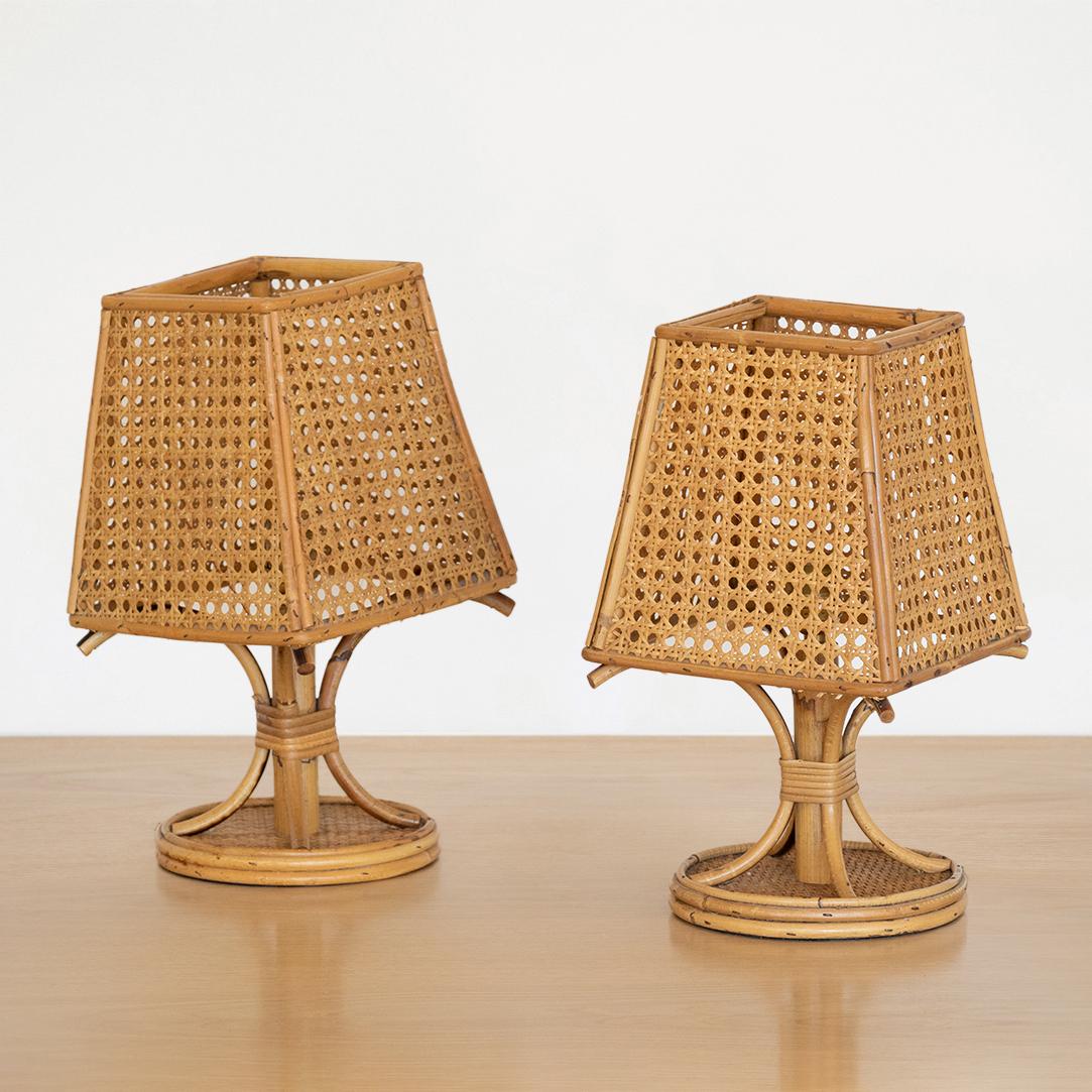 Unique pair of rattan and cane table lamps from Italy, 1960's. Original cane shade with rattan frame in great vintage condition. Newly rewired. Sold and priced as a pair.