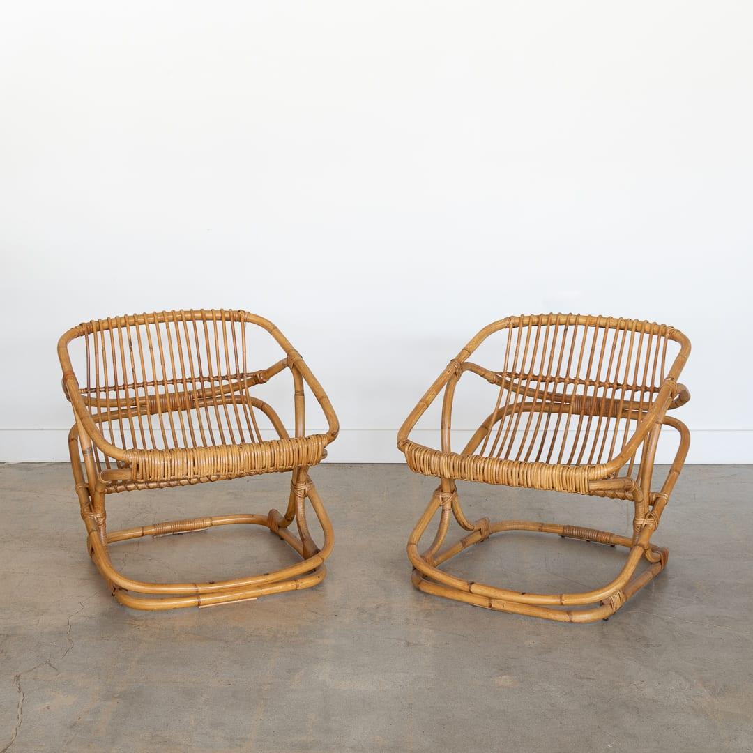 Lovely pair of rattan chairs from Italy, 1960s. Slatted rattan scoop seats with rattan and bamboo frame. Original finish shows nice age and patina. Sold as a pair. 

Seat height slopes from 15