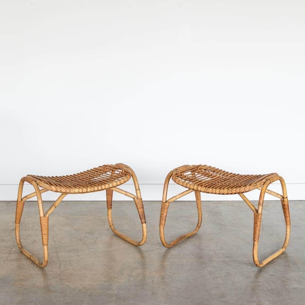 Lovely pair of rattan stools in the style of Tito Agnoli from Italy, 1960s. Slatted rattan seats with slightly curved seat and rattan and bamboo frame. Wrapped rattan detailing. Original finish shows nice age and patina. Sold as a pair. 