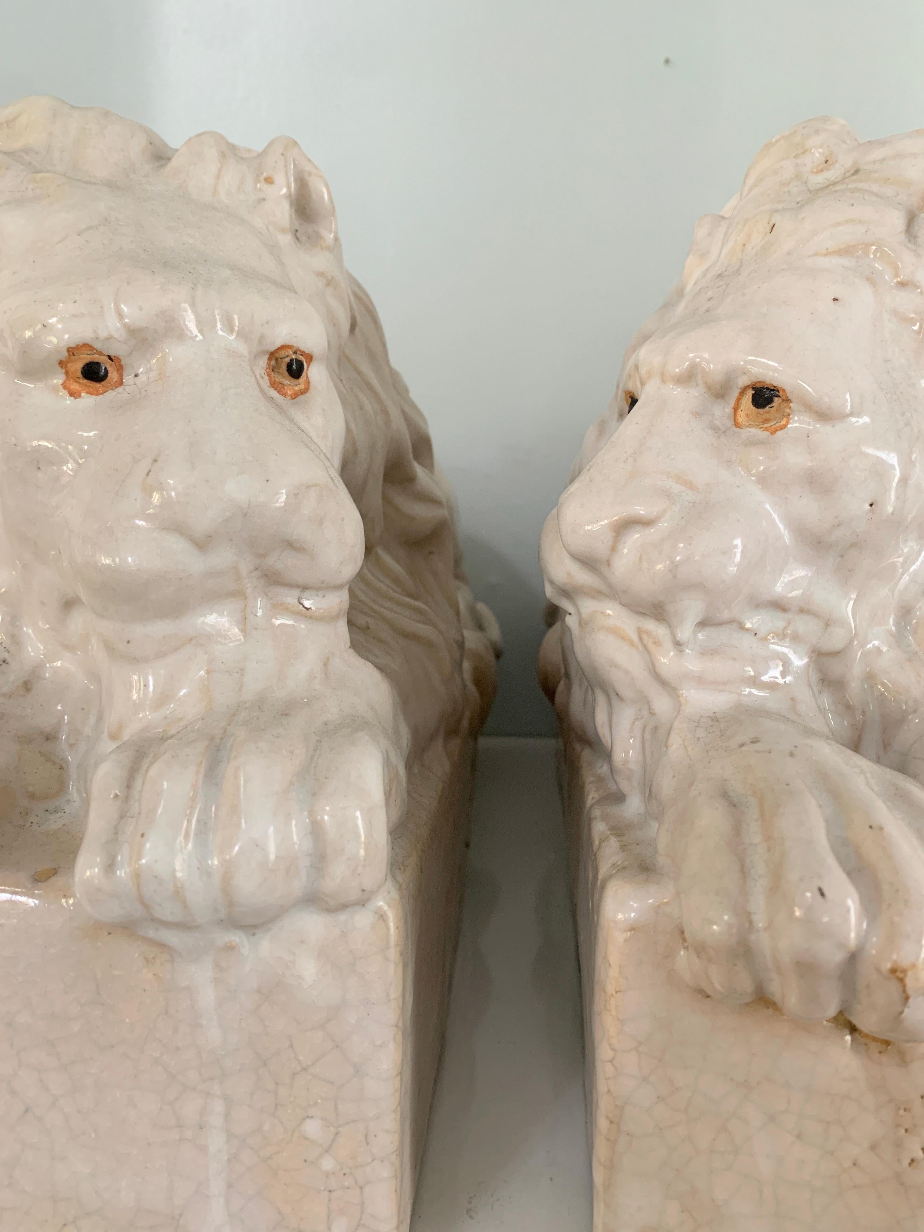 Pair of Italian Reclining Glazed Terracotta Lions In Good Condition For Sale In Los Angeles, CA