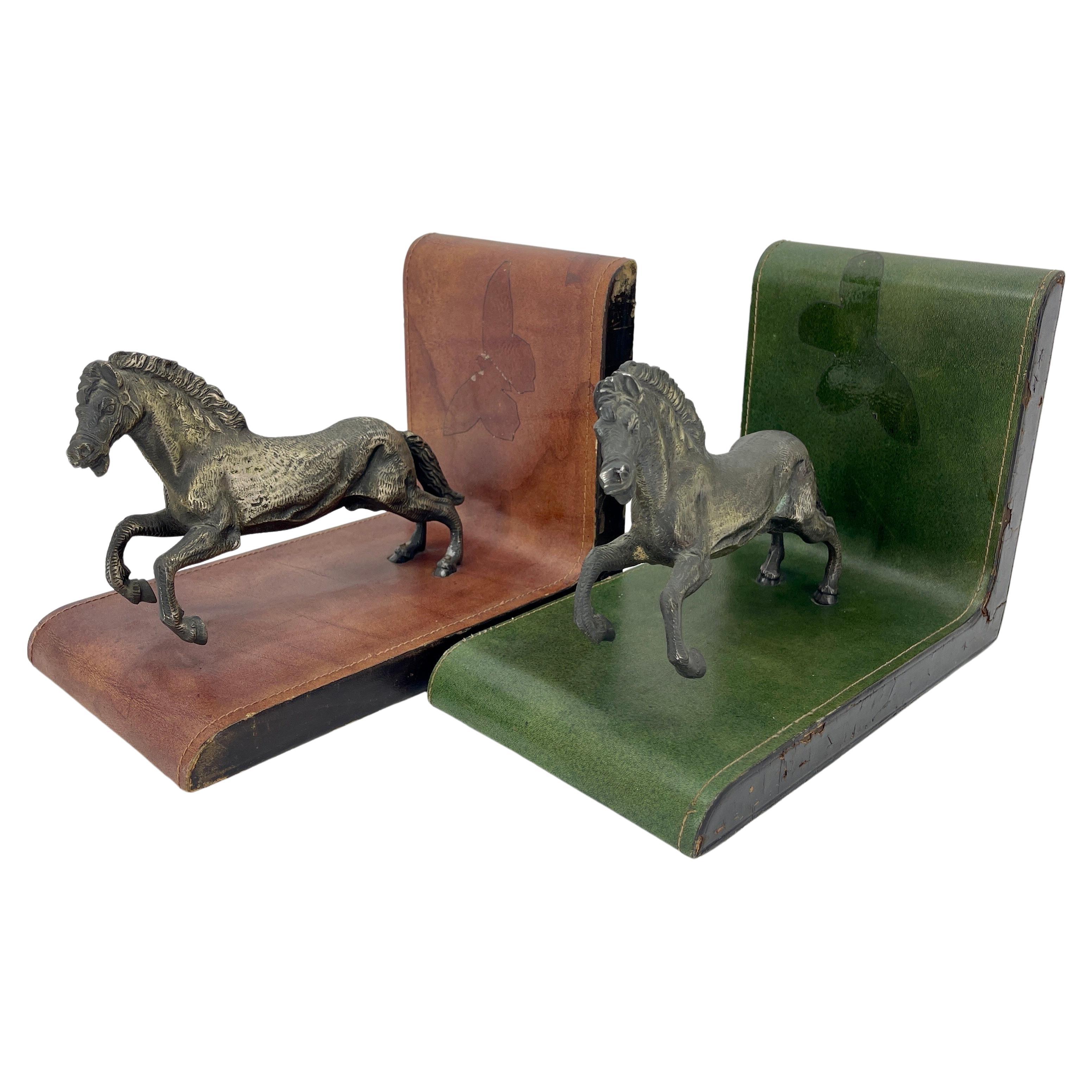 Extra Large Set of Vintage Leather Bookends with Patinated Bronze Horses in Full Sprint, Italy circa 1950s.
One bookend is in red leather and the other in green leather. The patina of the leather and bronze shows the unique patina of time given by
