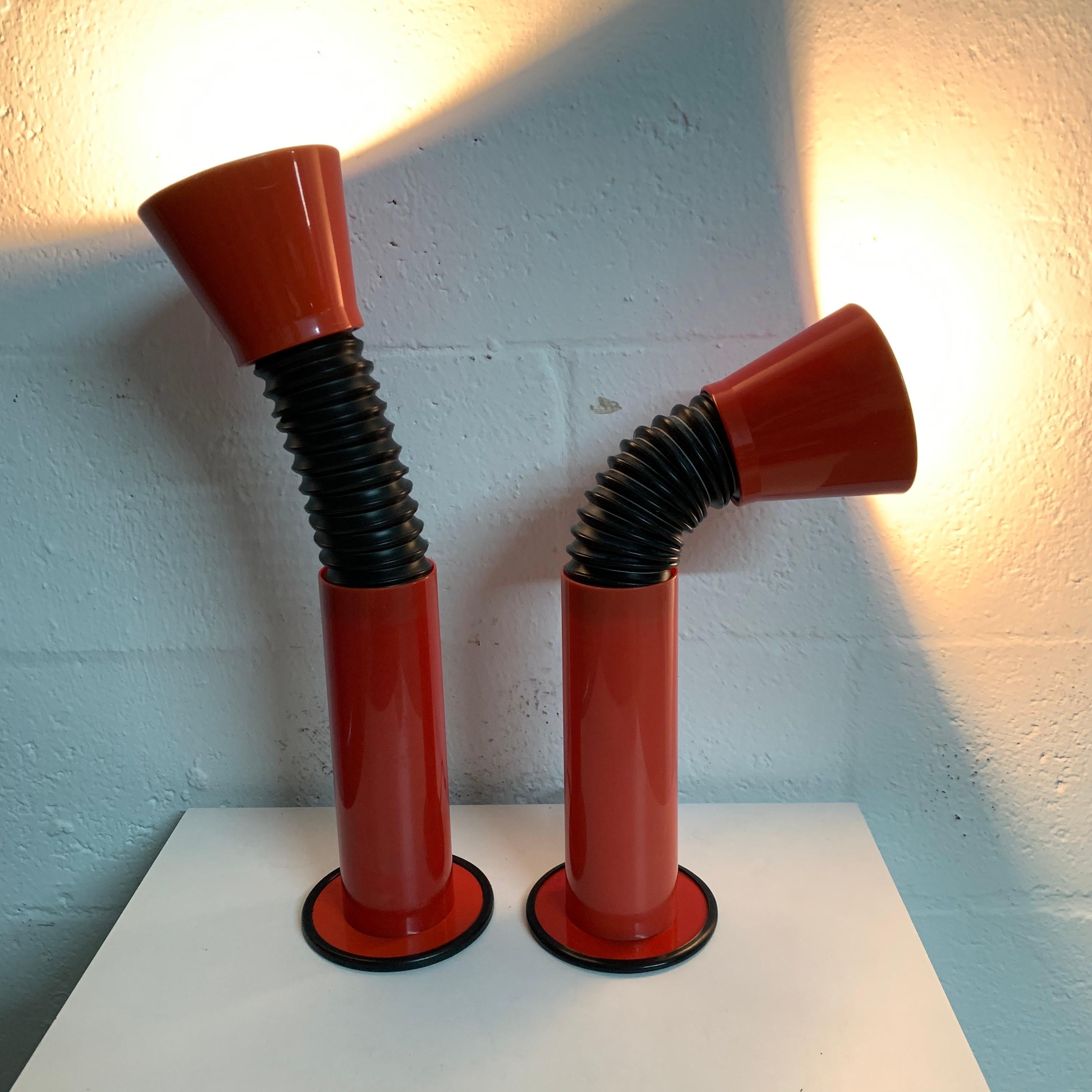 Unique pair of adjustable goose neck table desk or task lamps rendered in Red metal and plastic with a black gooseneck and cone shade head, Italy, 1980s.