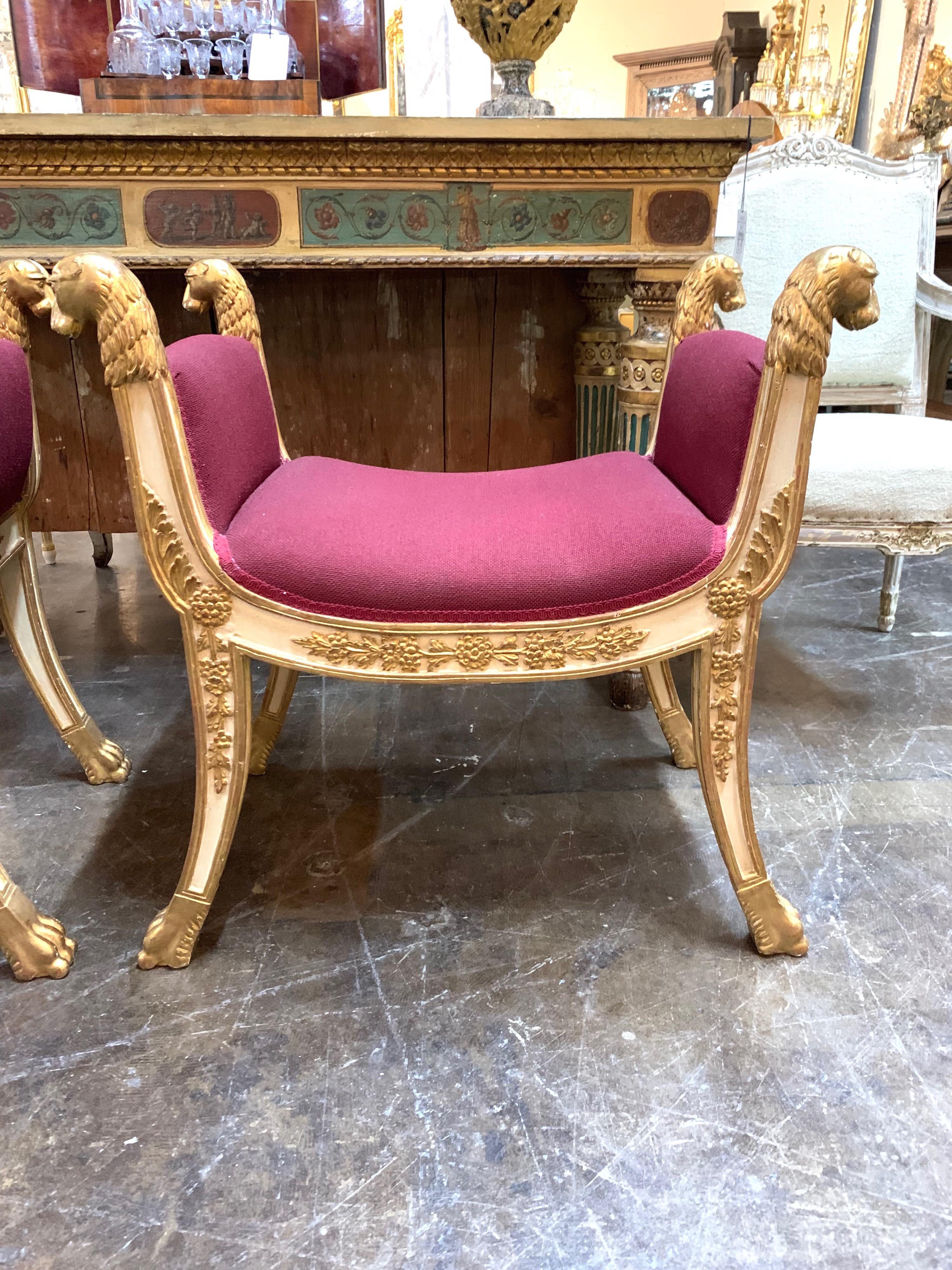 Elegant pair of upholstered Regency style carved and parcel-gilt benches. Lovely carving on this set. Makes a real statement in a Fine home. Sold as a set.