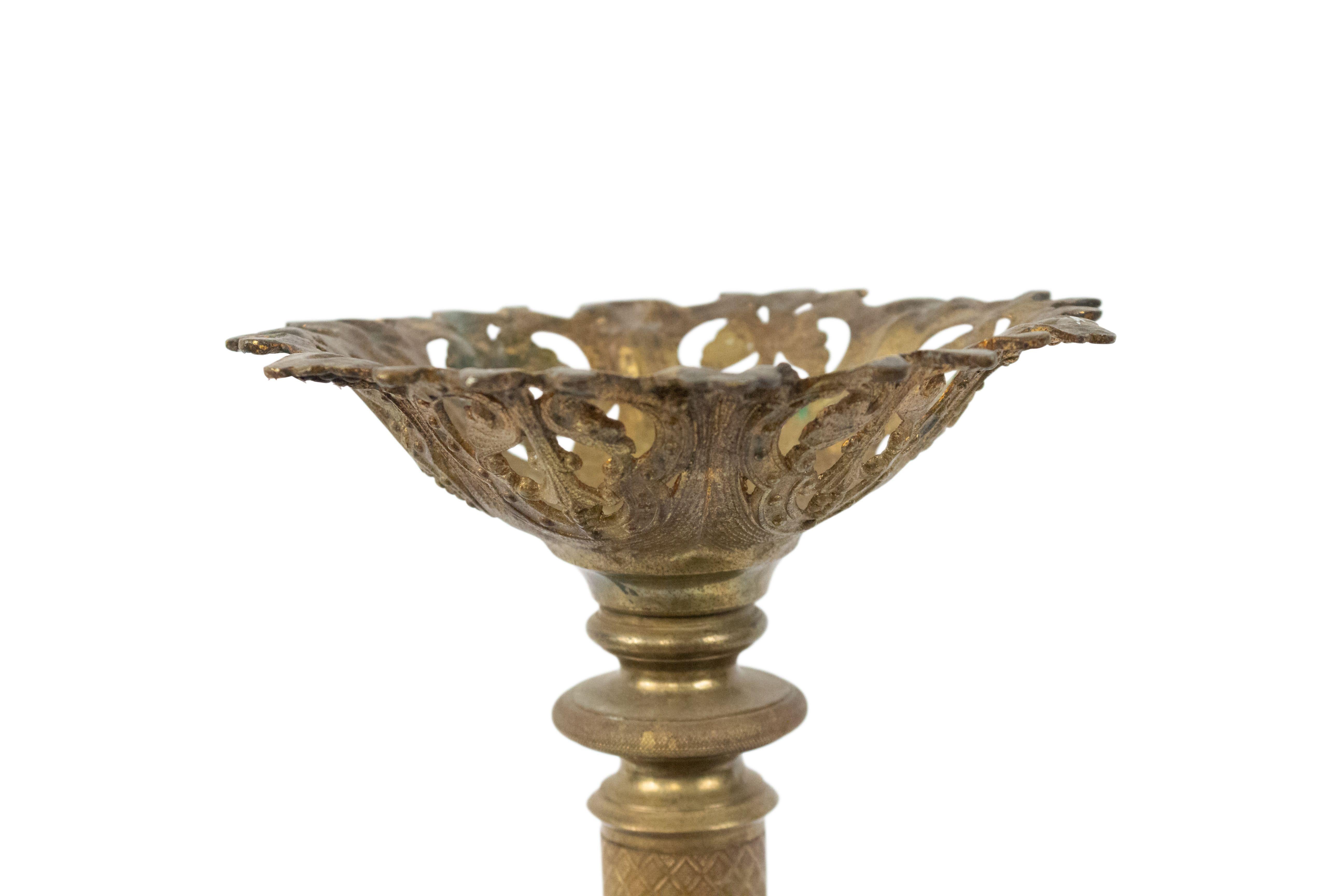 Pair of Italian Renaissance-style (19th Century) round bronze altar sticks with filigree top and base (priced as pair).
 