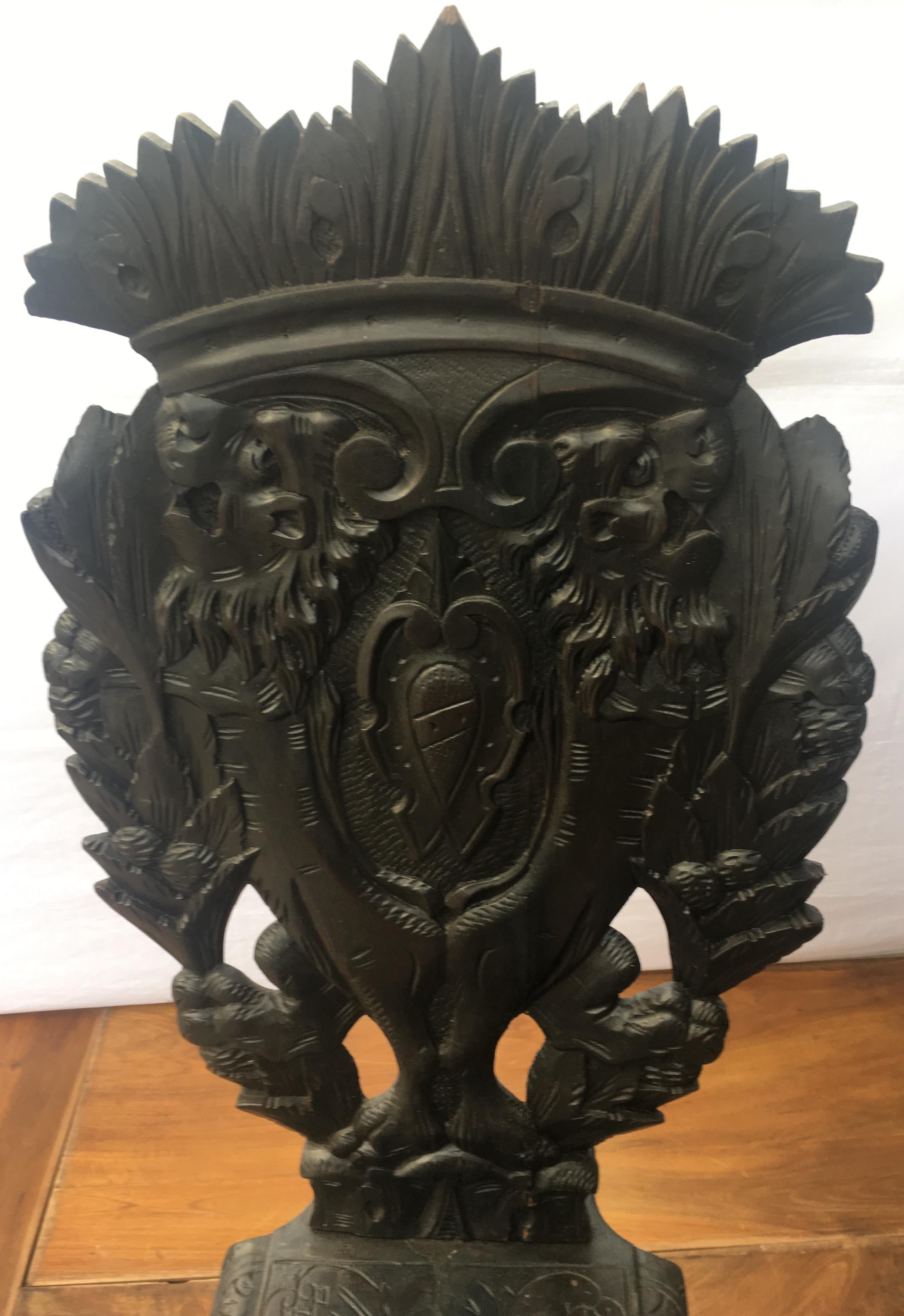 A fine pair of Italian 19th century heavily carved Sgabello side chairs. The entire front surface of each is hand carved and is beautifully sculpted. In the entrance halls of Italian Palazzos they were always an eye-catcher. They demonstrated the