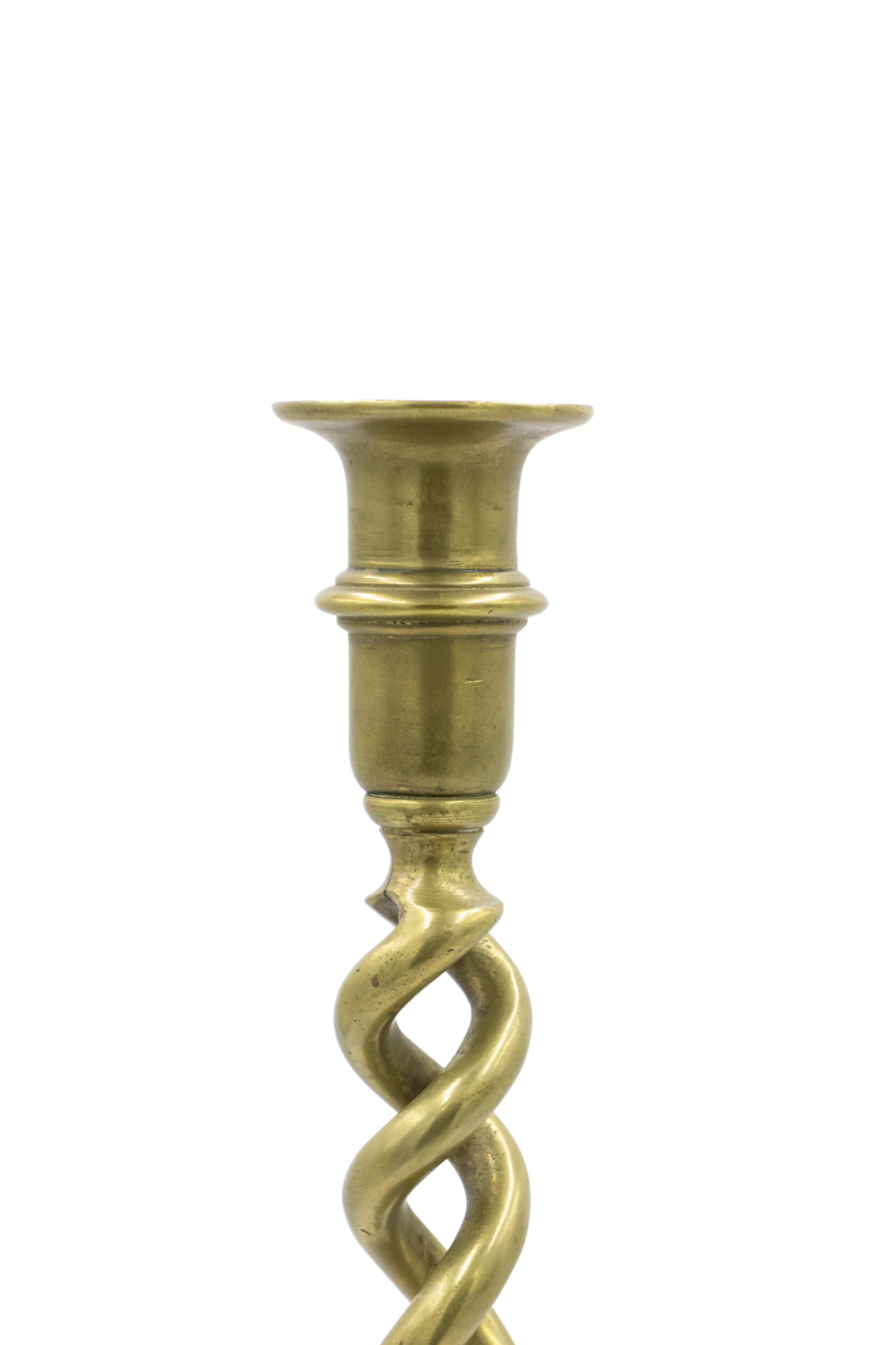 Pair of Italian Renaissance-style (19th century) brass double swirl candlesticks (priced as pair).
 