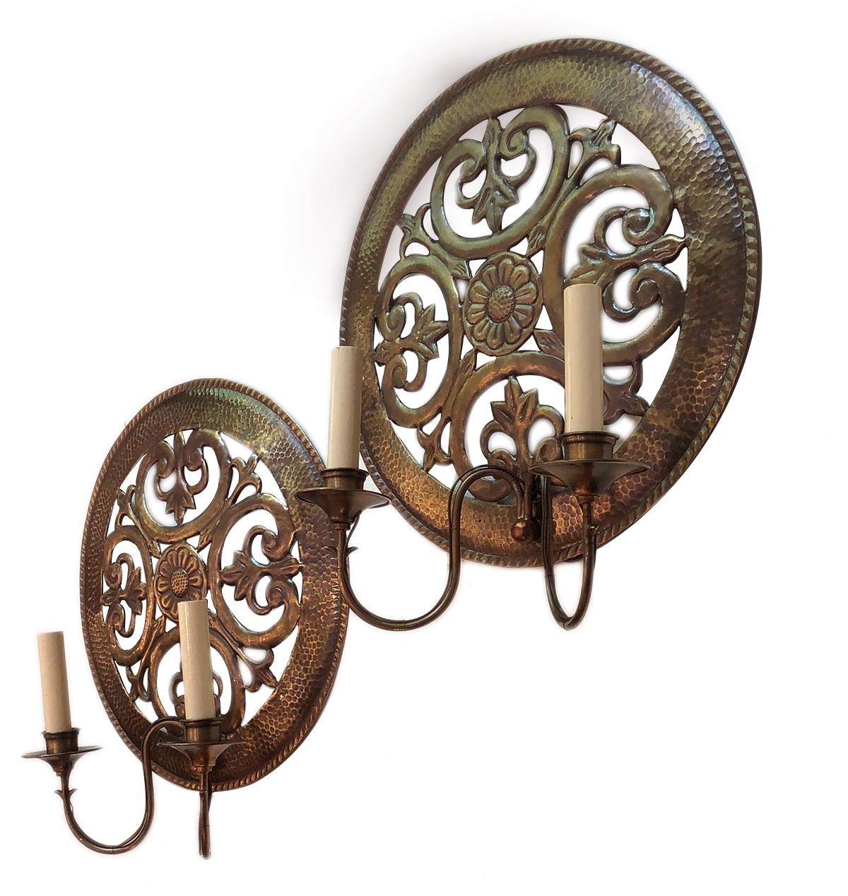 Pair of circa 1940s Italian pierced and hammered sconces with original patina.

Measurements:
Diameter of body 15