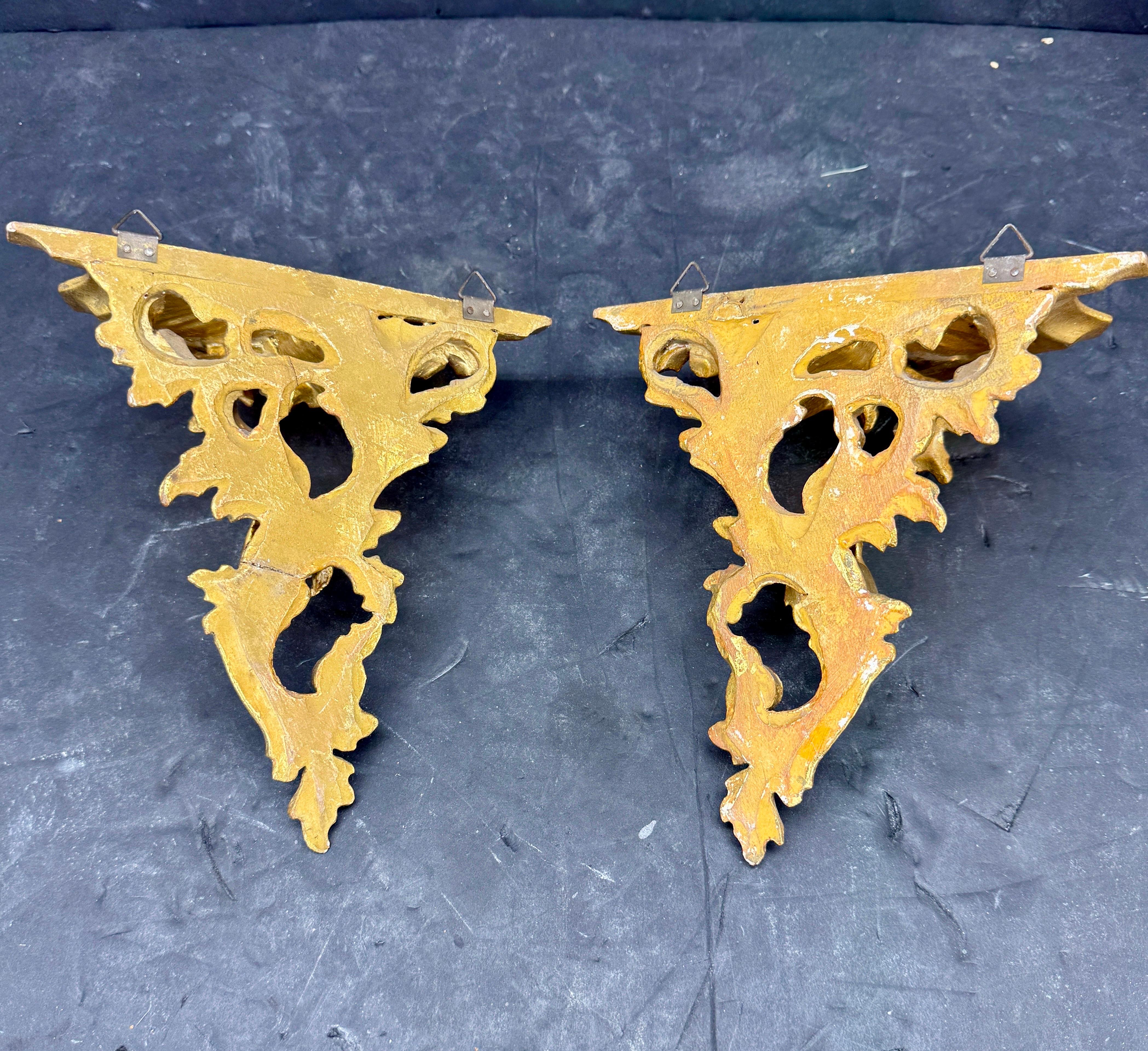 Gorgeous Italian Pair of Gold Leaf Wall Shelves. This high quality set could certainly stand alone as a pair on a wall or functional to hold treasures on top. Wonderful classic addition to any living room, dining room or bedroom setting. This set is