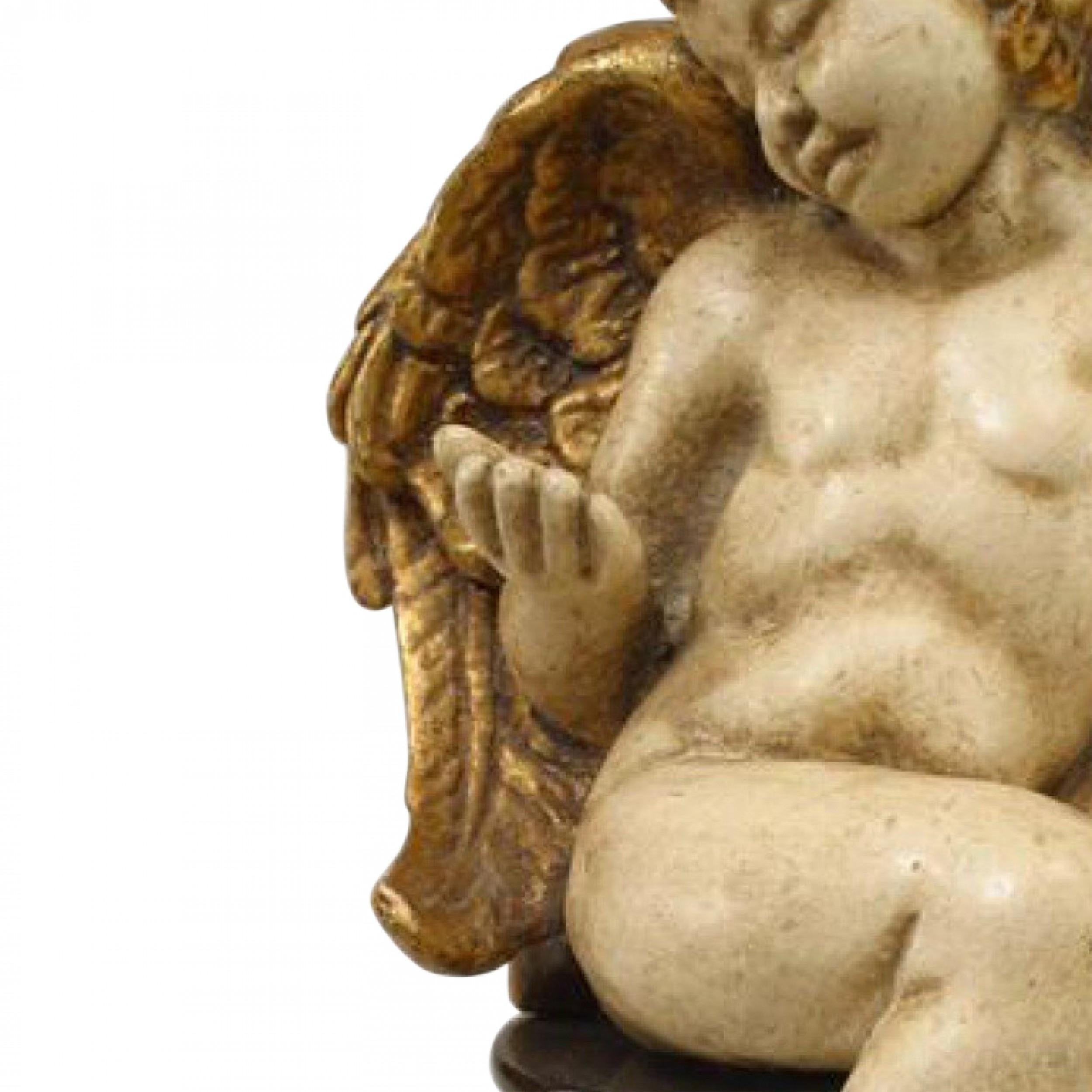 Pareja de cupidos italianos rococó dorados Pintado a mano en venta
