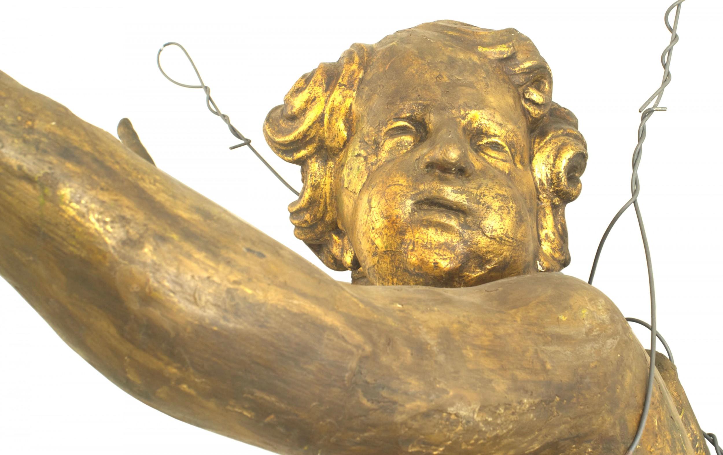 Pair of Italian Rococo (18th Cent) gold painted life size hanging cupid figures.