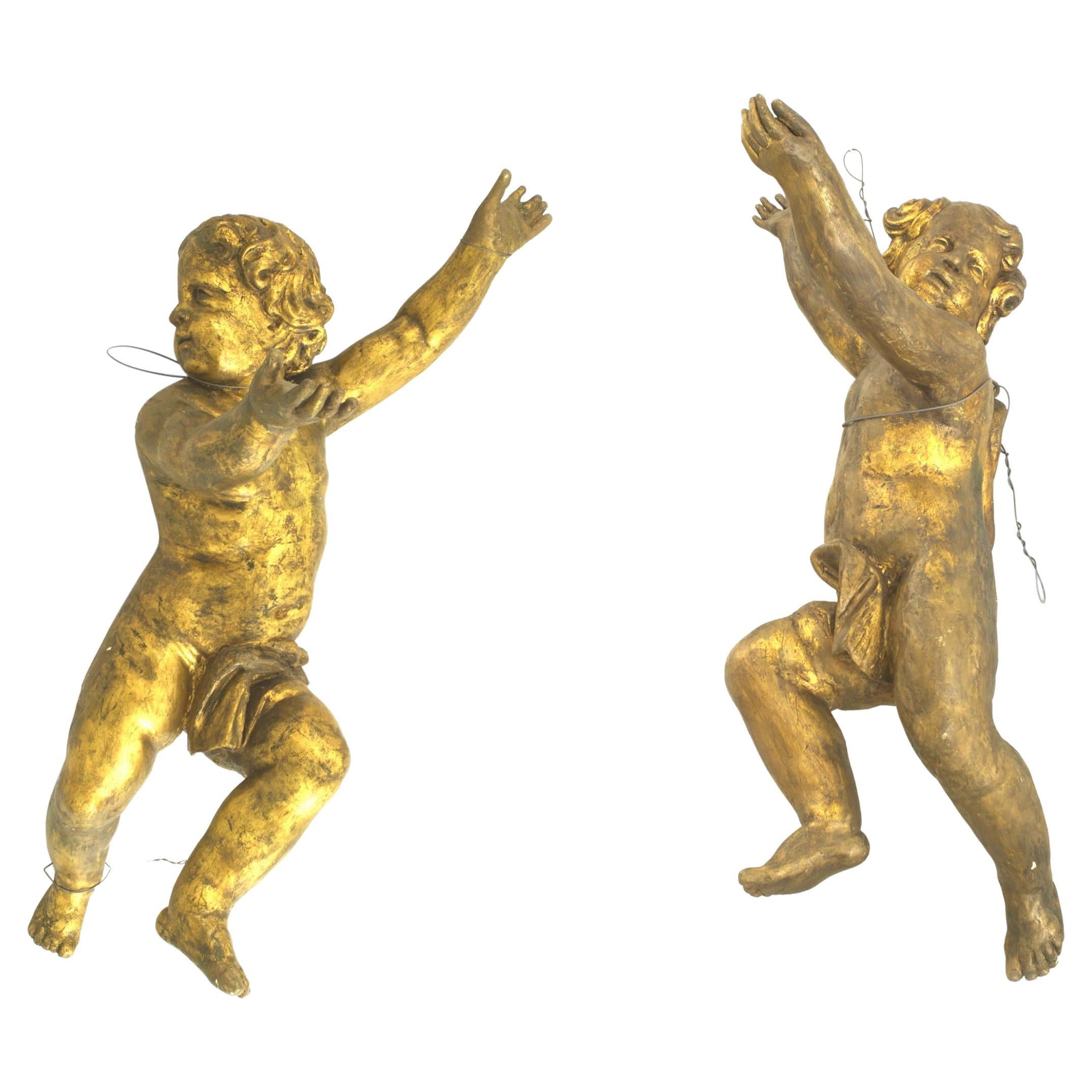 Pair of Italian Rococo Gold Painted Cupids For Sale