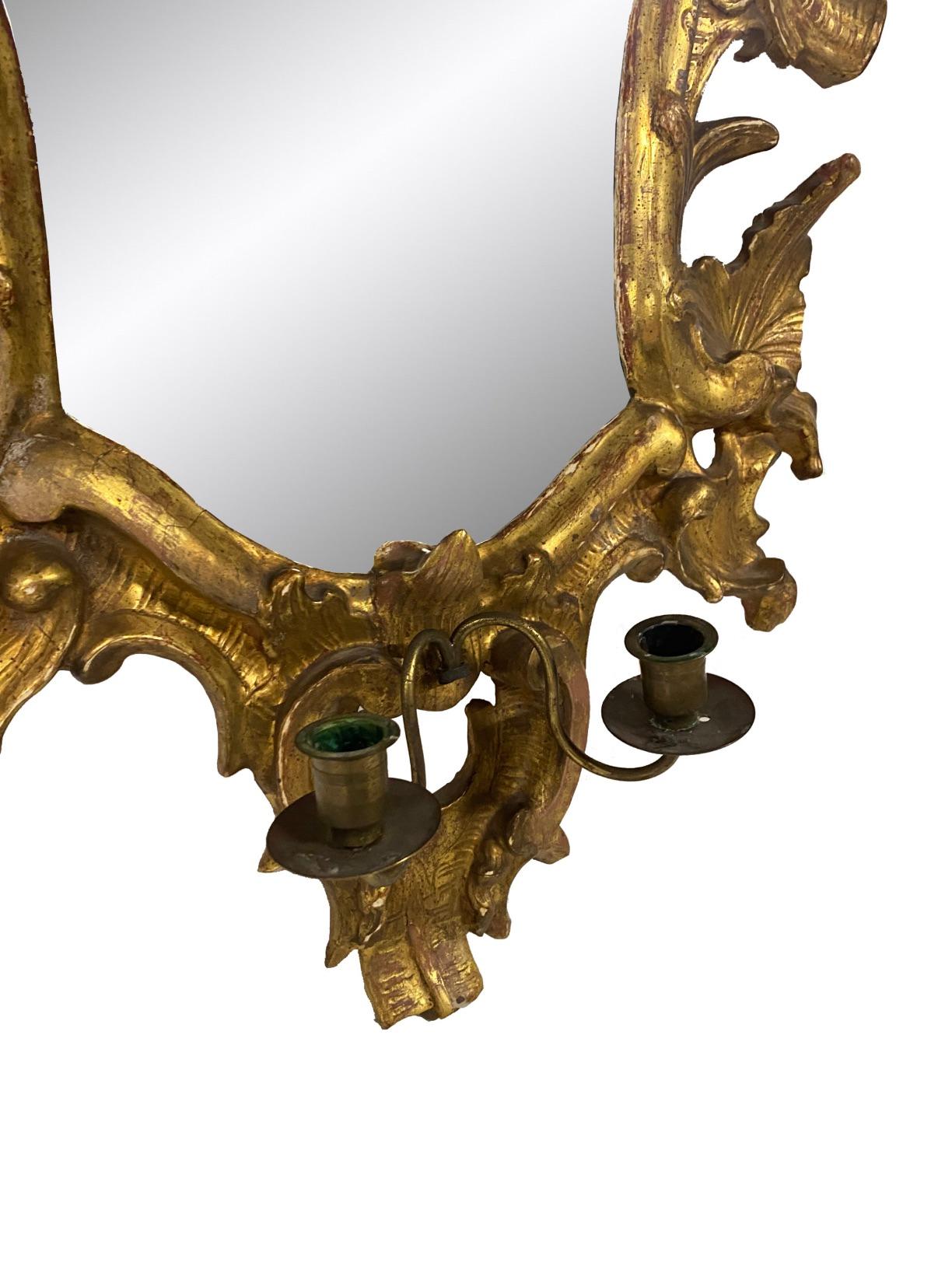 Pair of Italian Rococo Mirrored Gilt Wall Sconces with Candleholders

Need to find candle holder replacement/

Italian Rococo mirrored sconces with candleholders and adorned with carved gilt wood acanthus leaves 

Dimension: 34″H x 23″W x 2.5’D

