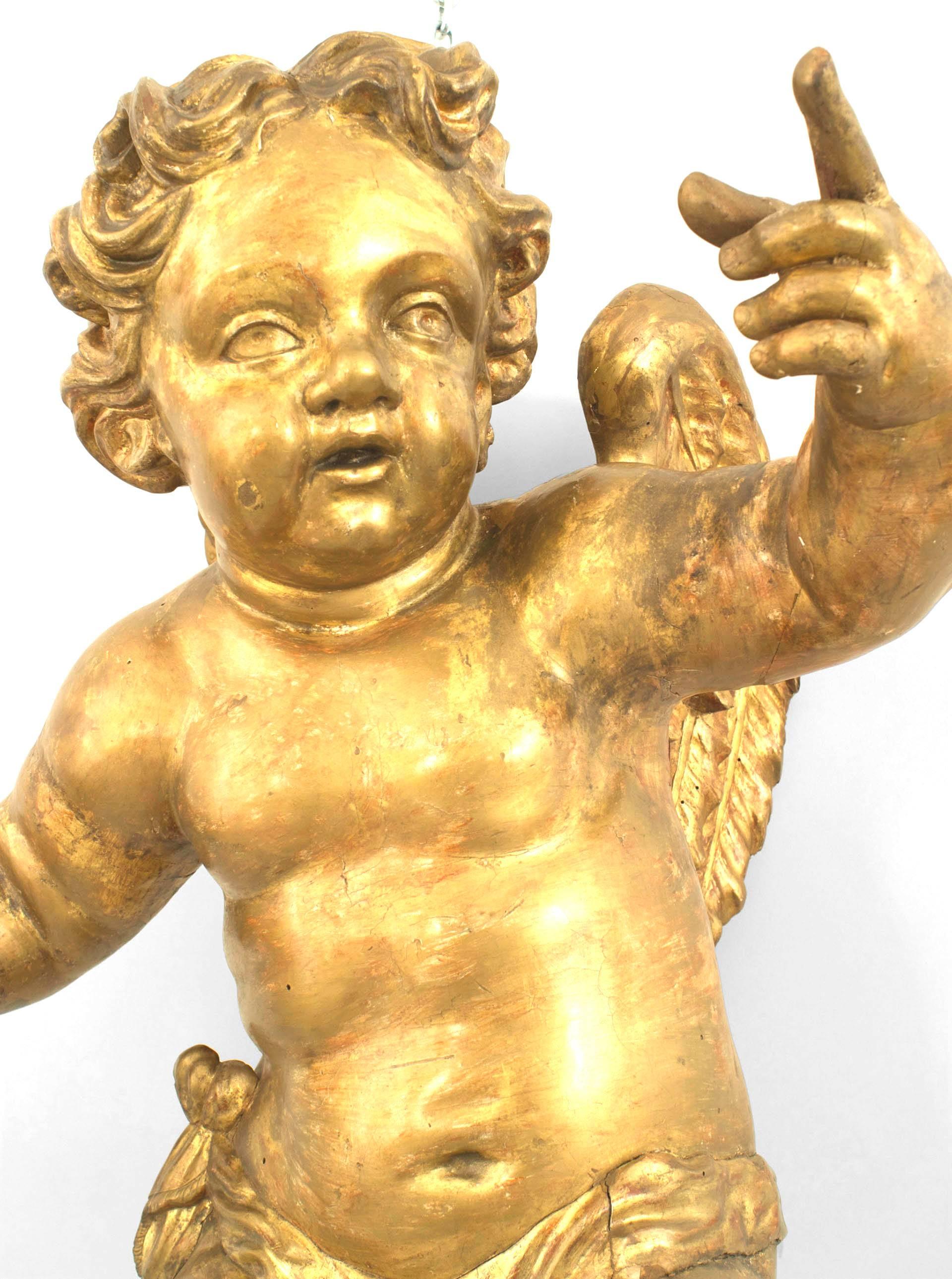 Pair of Italian Rococo Style Life-Size Hanging Cupids In Good Condition For Sale In New York, NY