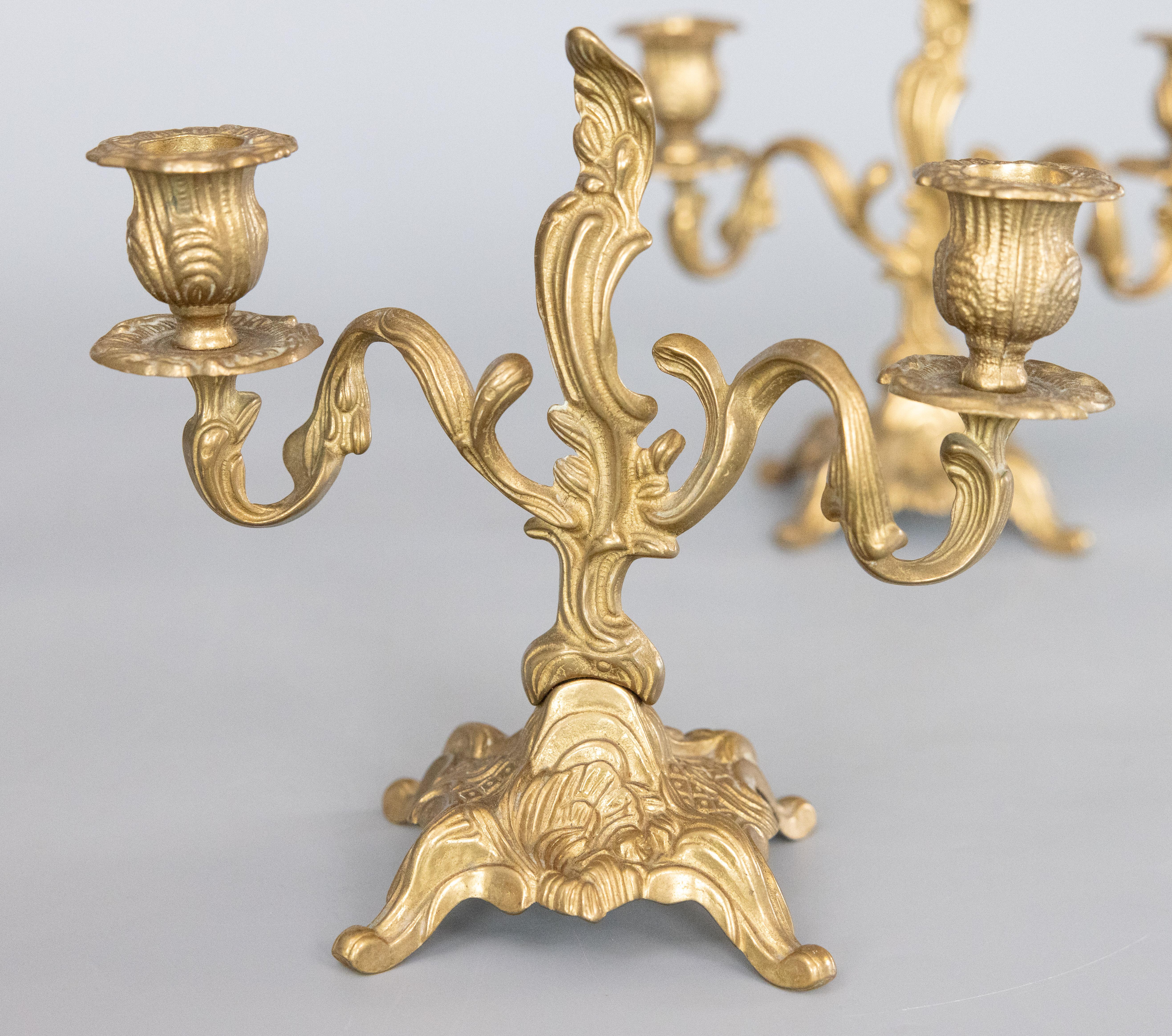 A gorgeous pair of vintage Italian Rococo style gilt brass two arm candelabras, circa 1950. Marked 
