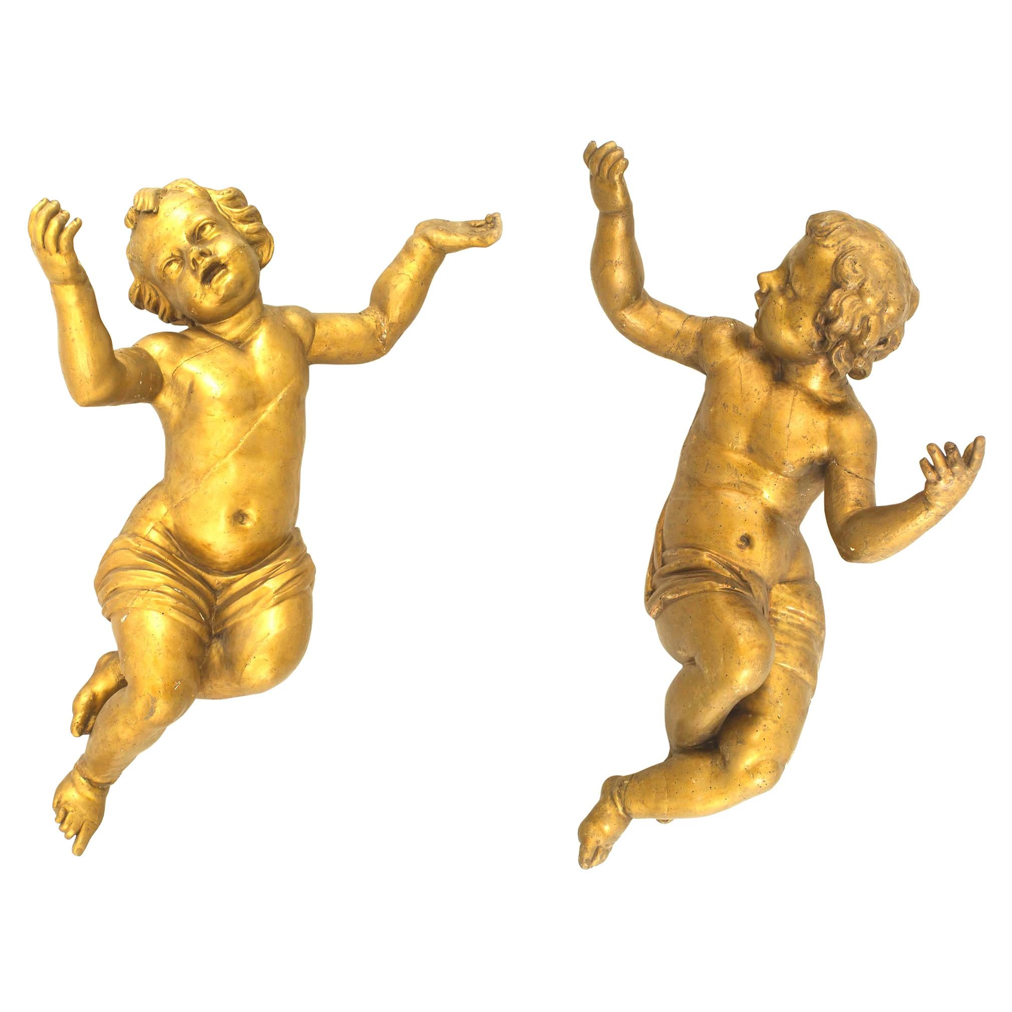 Pair of Italian Rococo Gold Painted Cupids For Sale