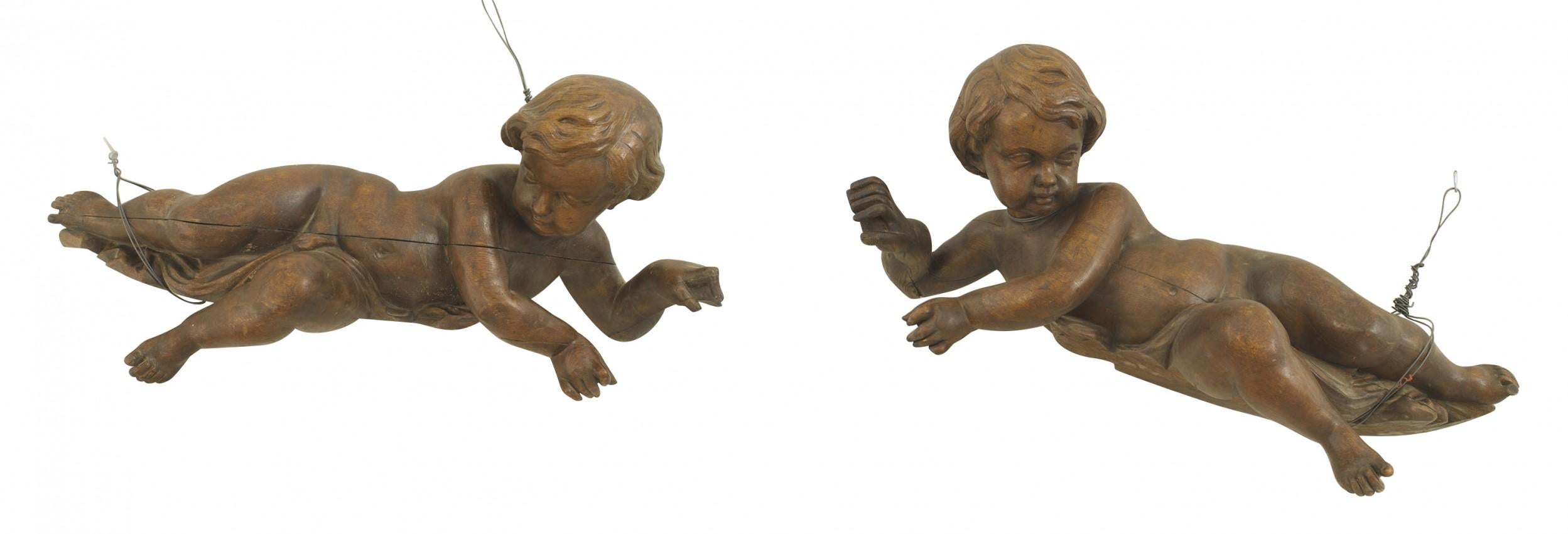 Pair of Italian Rococo Walnut Cupid Figures In Good Condition In New York, NY