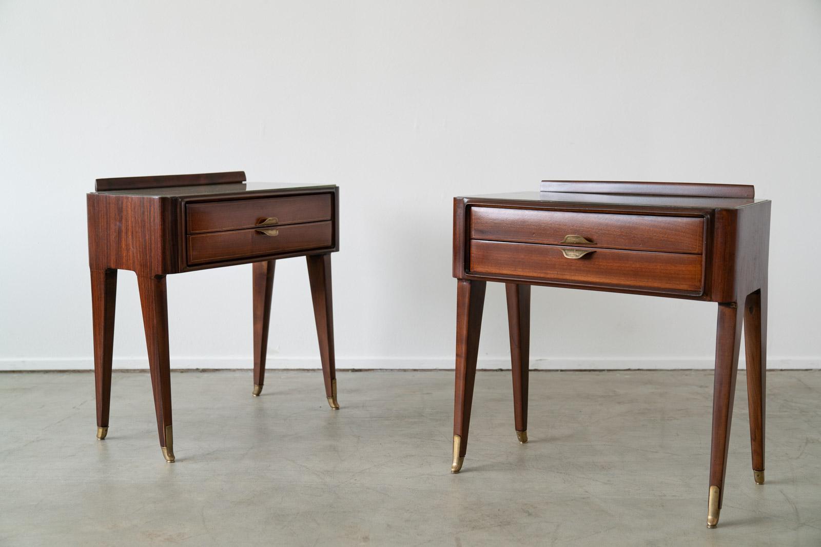 Gorgeous pair of Italian nightstands in the style of Gio Ponte. 
Original opaque glass, great patina to brass hardware and angled legs. 
Beautifully refinished in French Polish finish. 
  