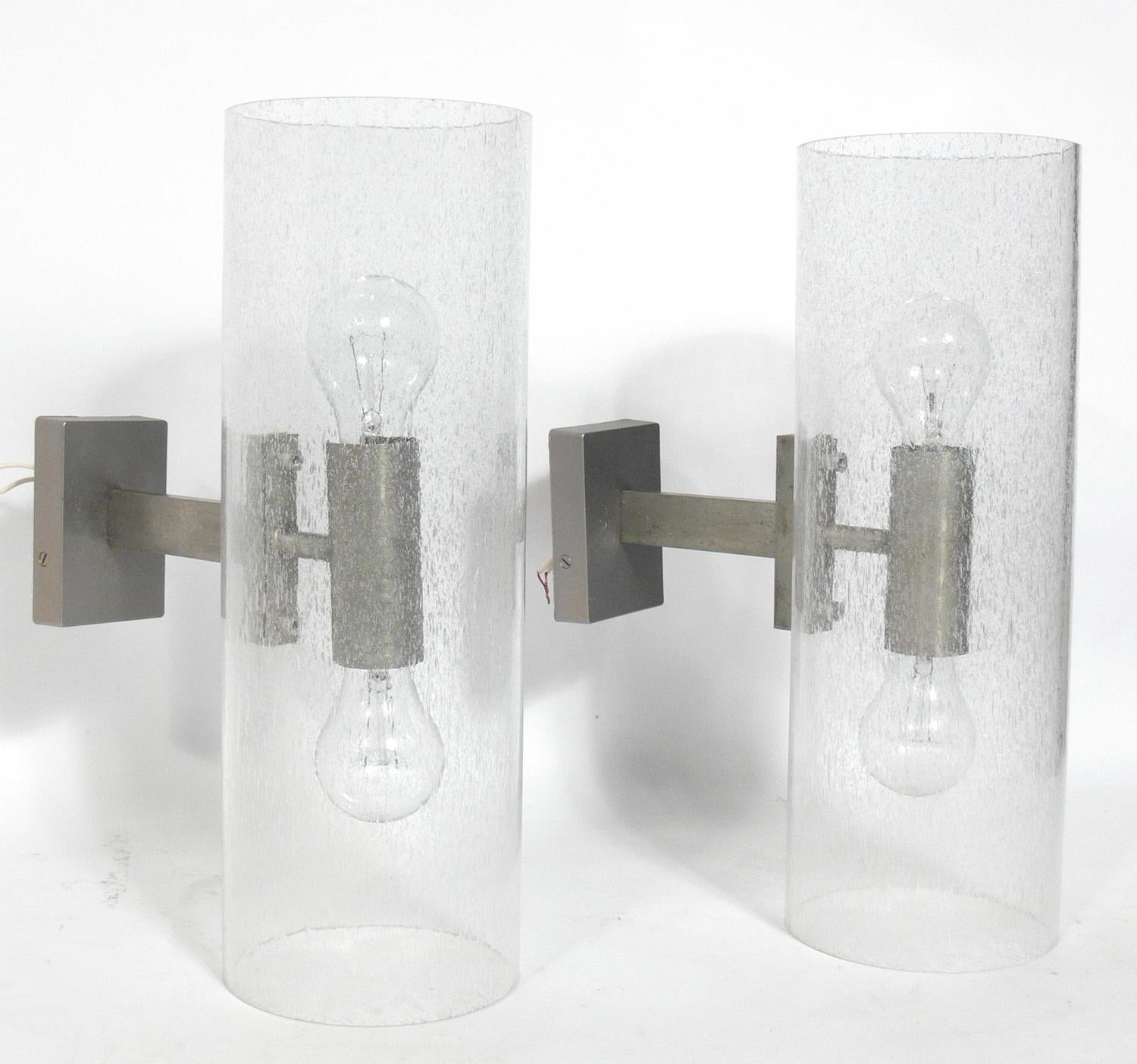 Pair of Italian sconces in controlled bubble glass and silvered metal, Italy, circa 1960s. They give off a warm light when lit. Rewired and ready to mount.