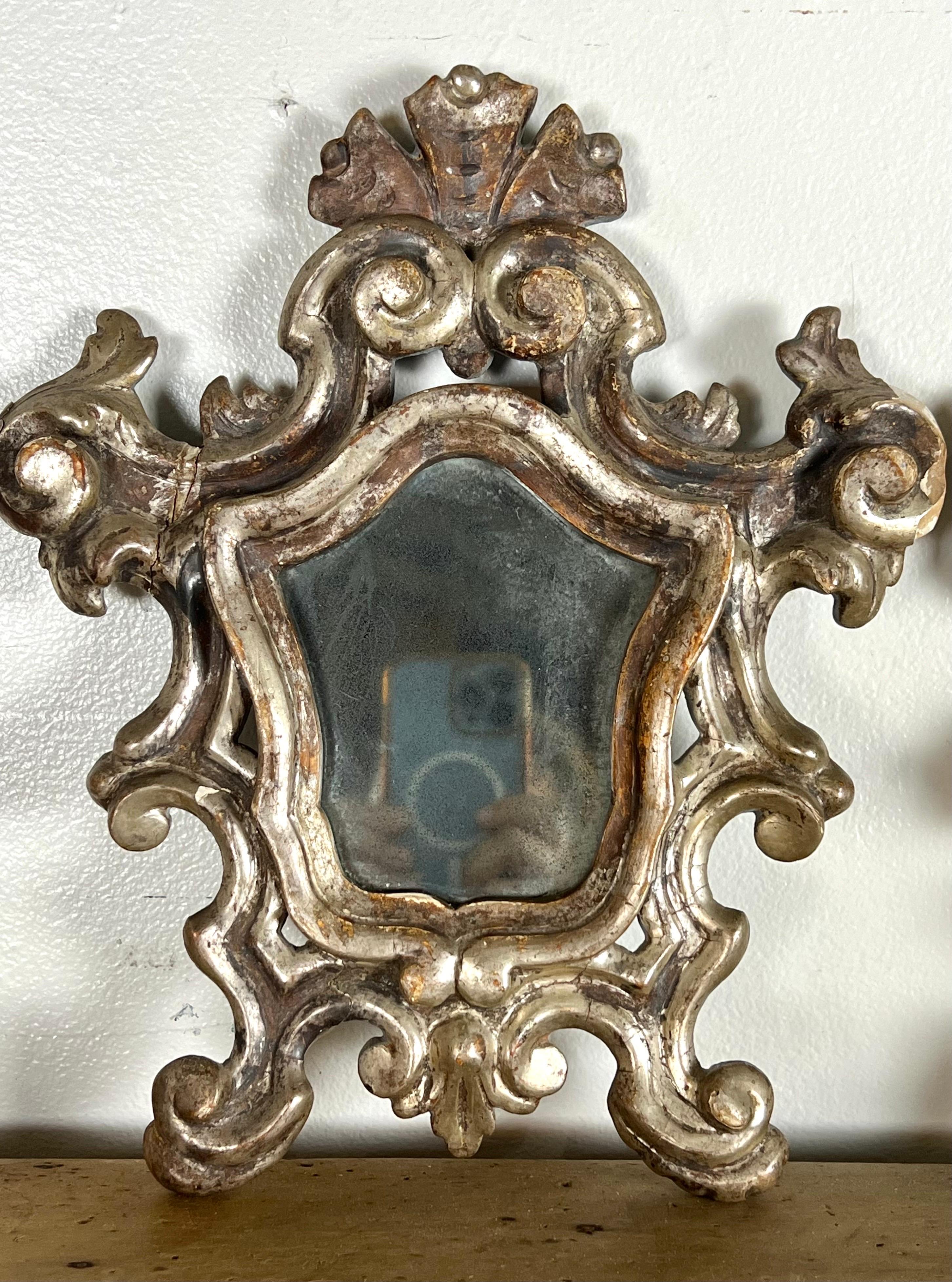 Pair of Italian Scrolled Silver Leaf Baroque Style Mirrors In Distressed Condition For Sale In Los Angeles, CA