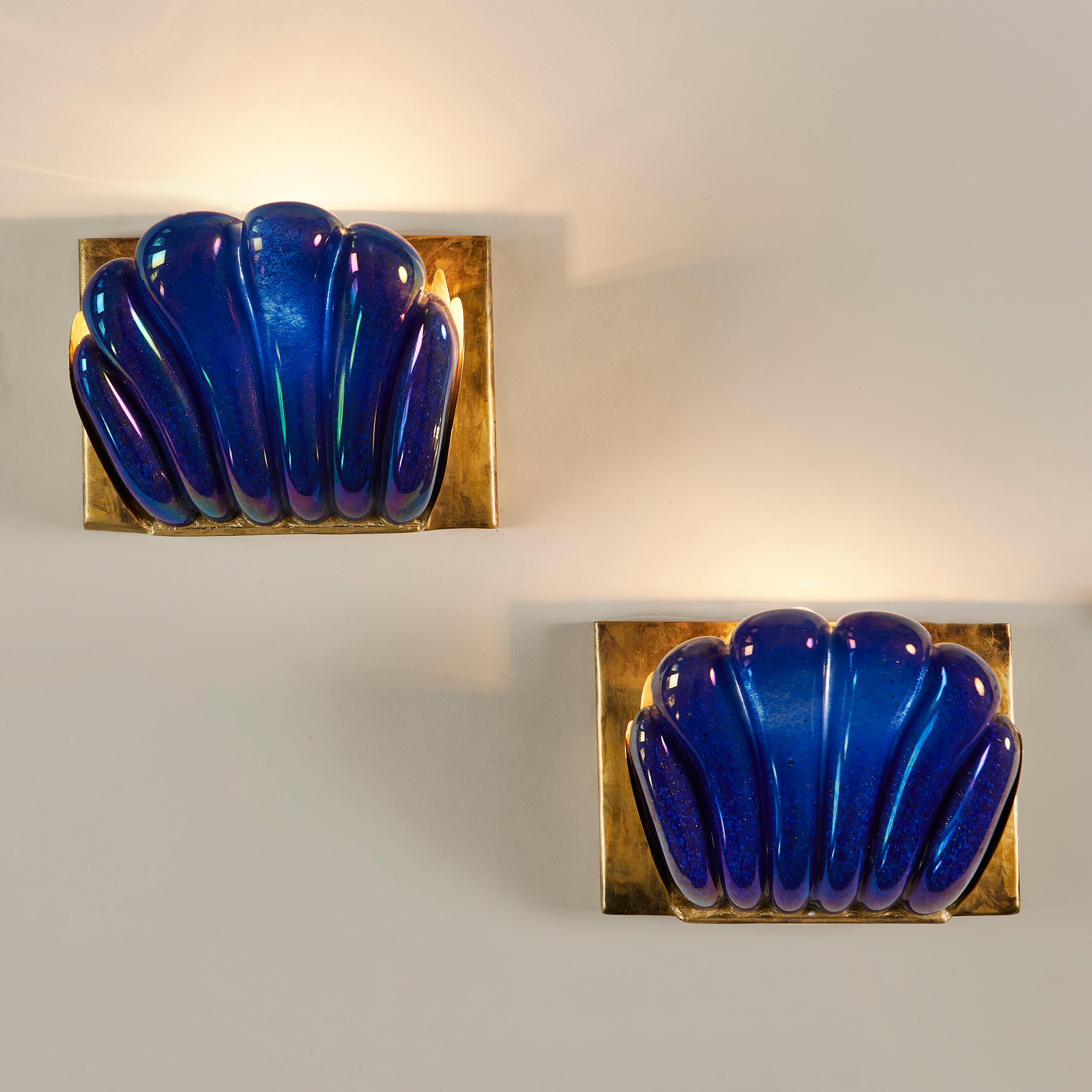 Thick smooth and generously scalloped Murano glass in rich iridescent Egyptian blue. Sits on brass backplate. Perfect mood lighting. Marked 'Seguso Vetri D'Arte Murano'
