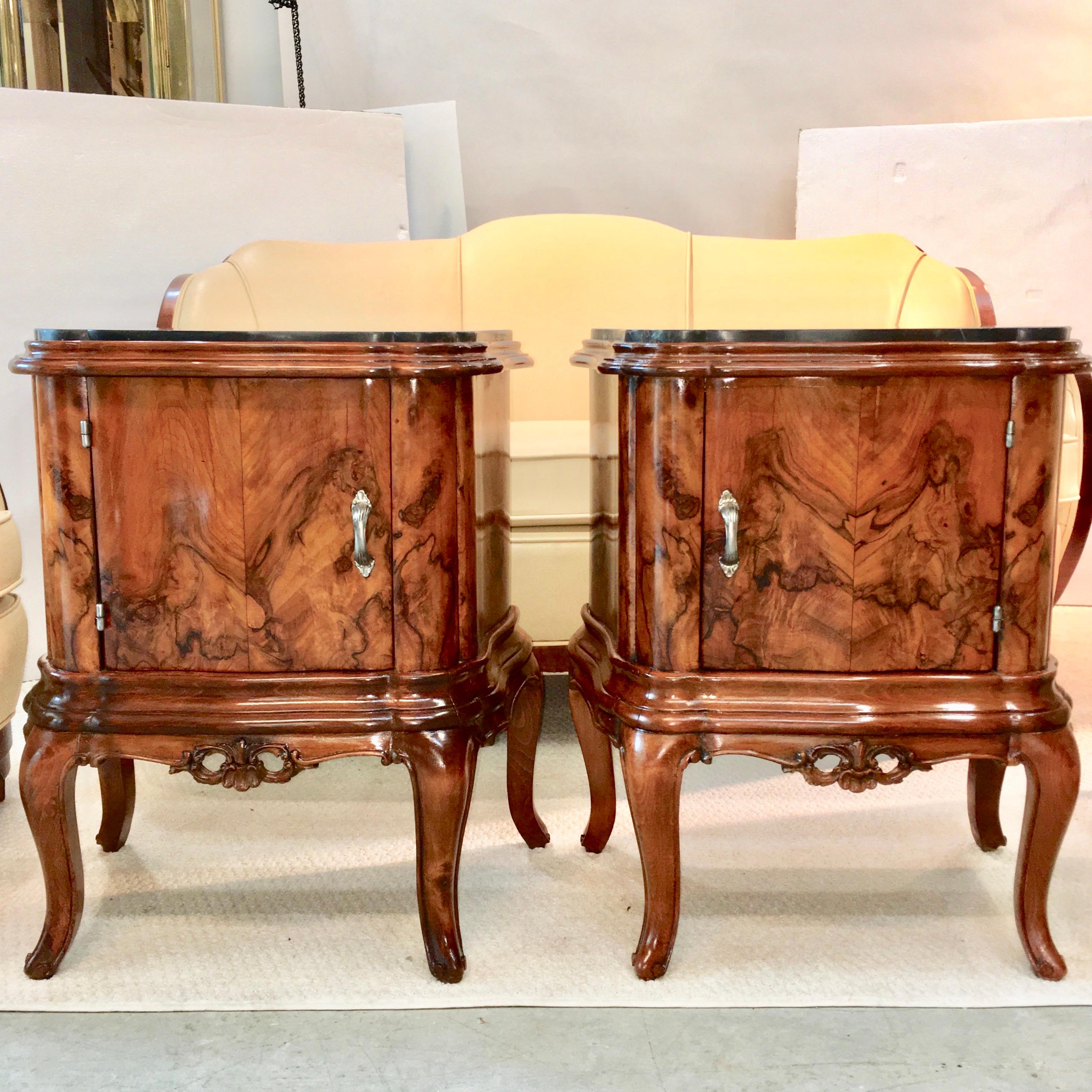 Pair of Italian figured walnut serpentine form bedside commodes with marble tops and single cabinet doors. Single shelf inside cabinet.
Beautifully restored and polished.
One has label 