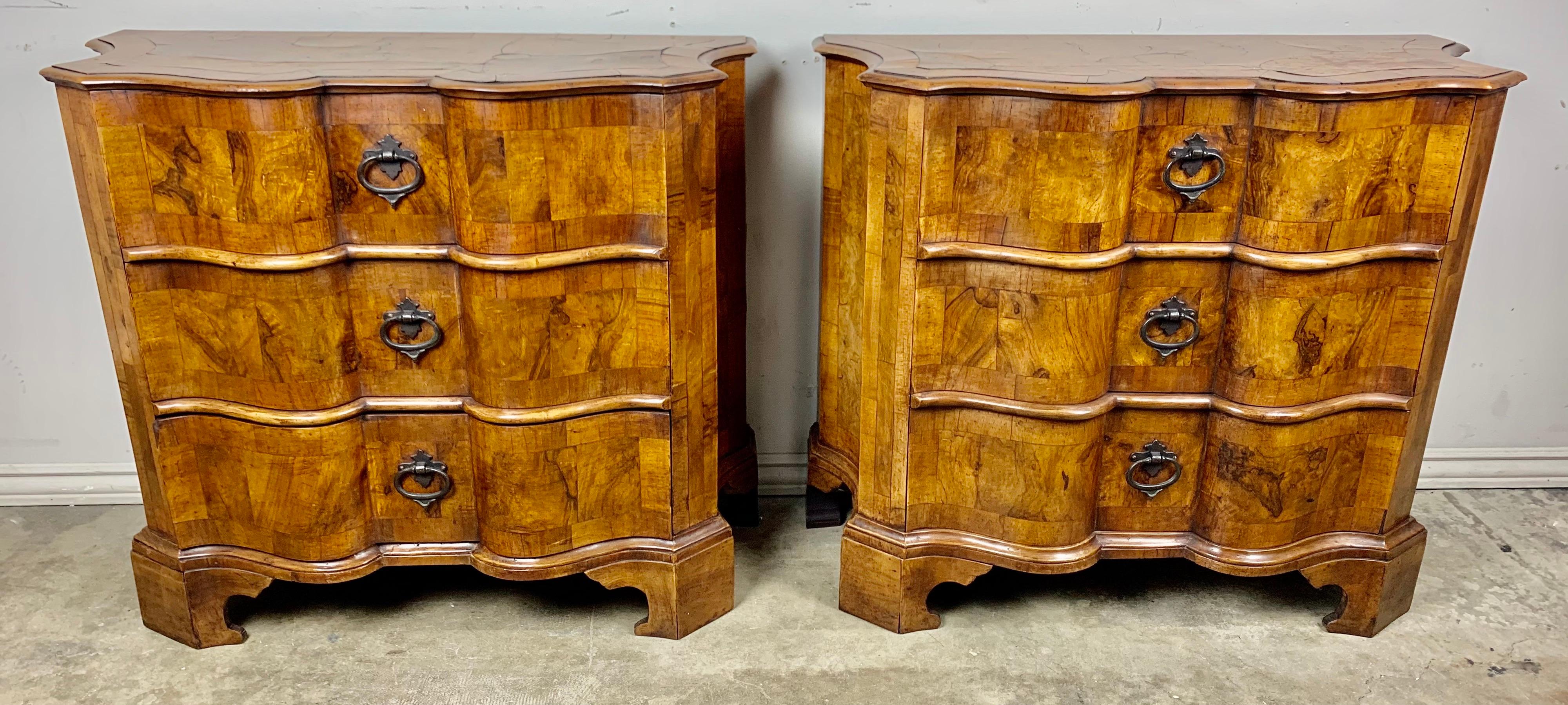 Pair of 1930's Italian serpentine shaped burl walnut 3-drawer commodes. The commodes are beautifully made and have developed a nice patina over the years. Original hardware.
