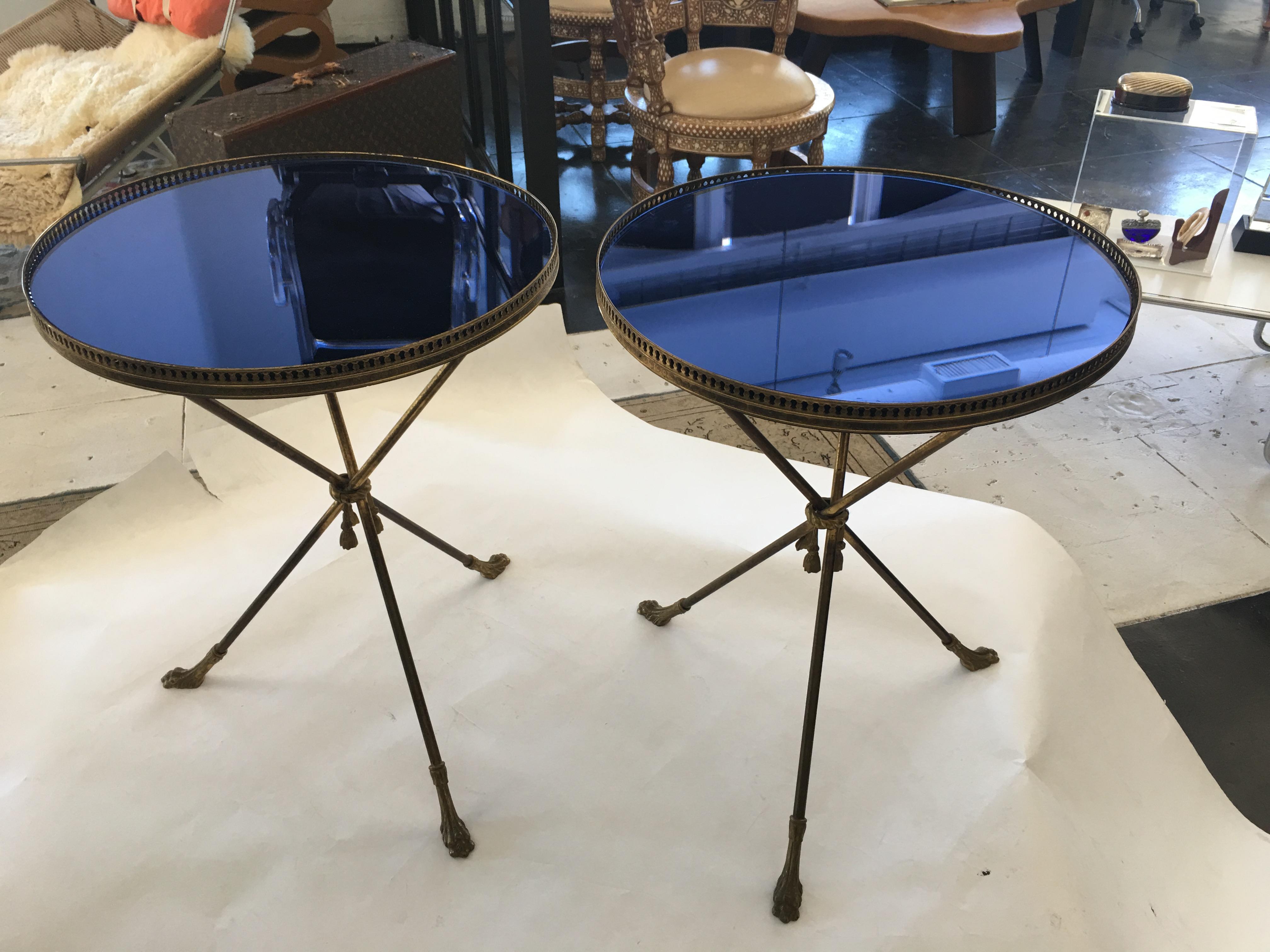 Beautiful Italian 1950th side tables with brass base and blue glass top. Available for purchase as a set or individually.