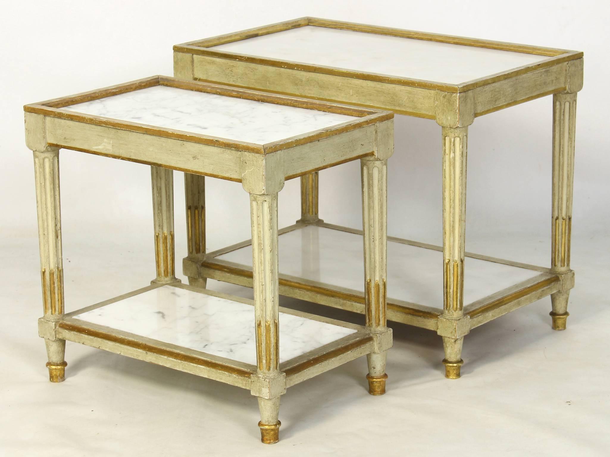 A pair of Italian neoclassical style, carved and painted marble topped side tables with gilt accents.