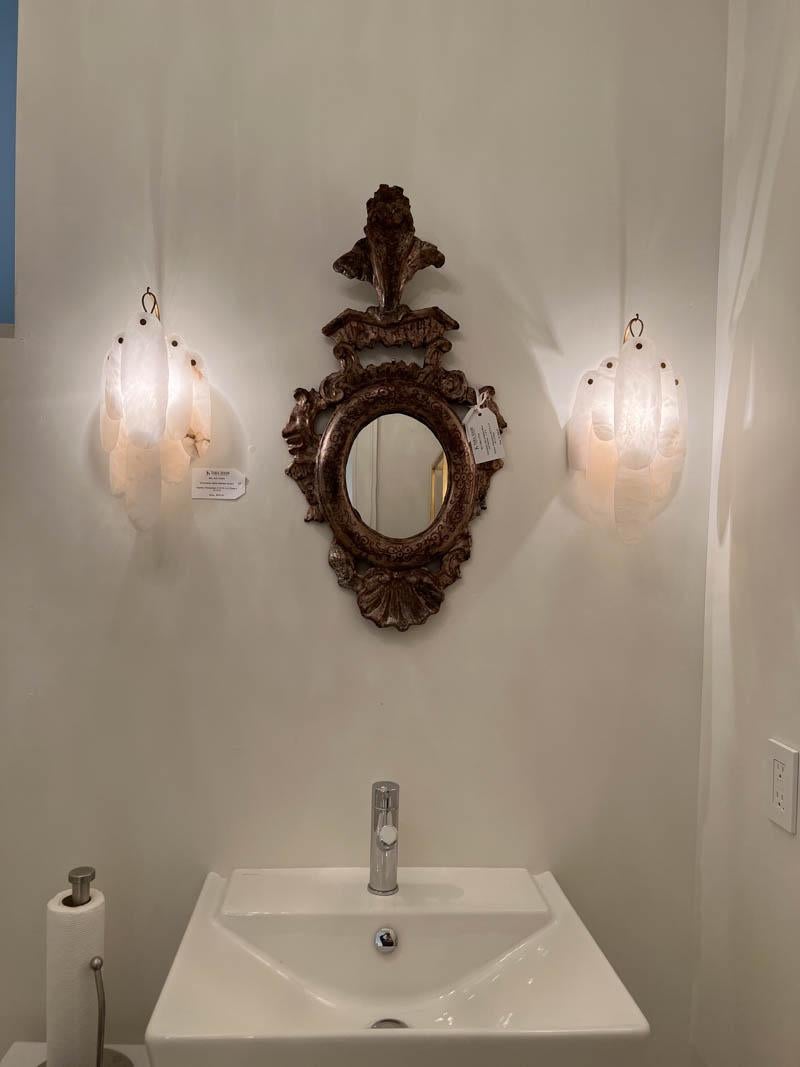 A matching pair of silver leaf mirrors in the Venetian style.