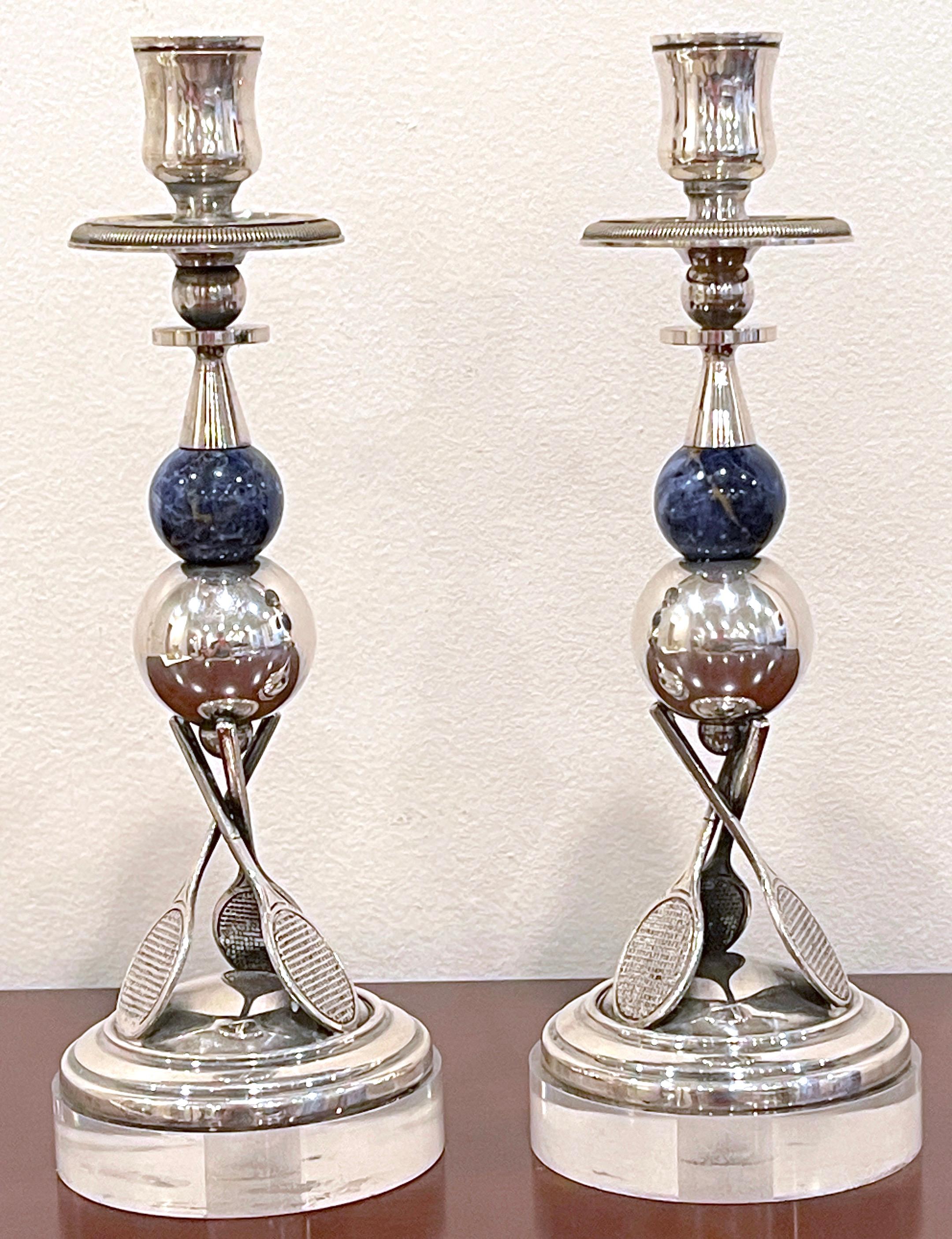 A Pair of Italian Silver-Plated, Lapis & Lucite Tennis motif candlesticks 
Italy, circa 1970s
A whimsical pair of Silver-plated Candlesticks, the design, reminiscent of Gucci and Buccellati works. 
Each candlestick fitted with a single bobeche,