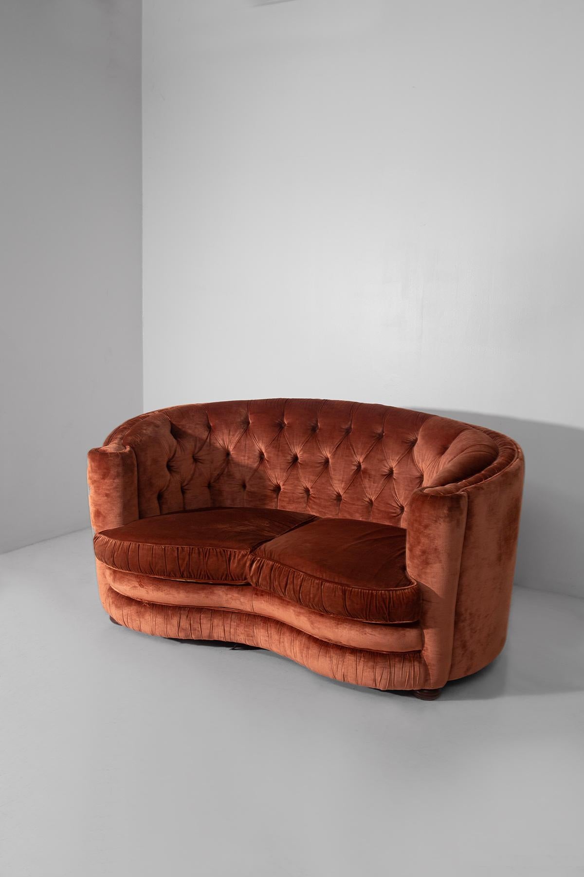 Allow yourself to be won over by the sophisticated charm of this very elegant pair of Italian Art Deco sofas from the 1970s, a rare example of beauty, comfort and craftsmanship of the highest level. A set that encapsulates the essence of the refined