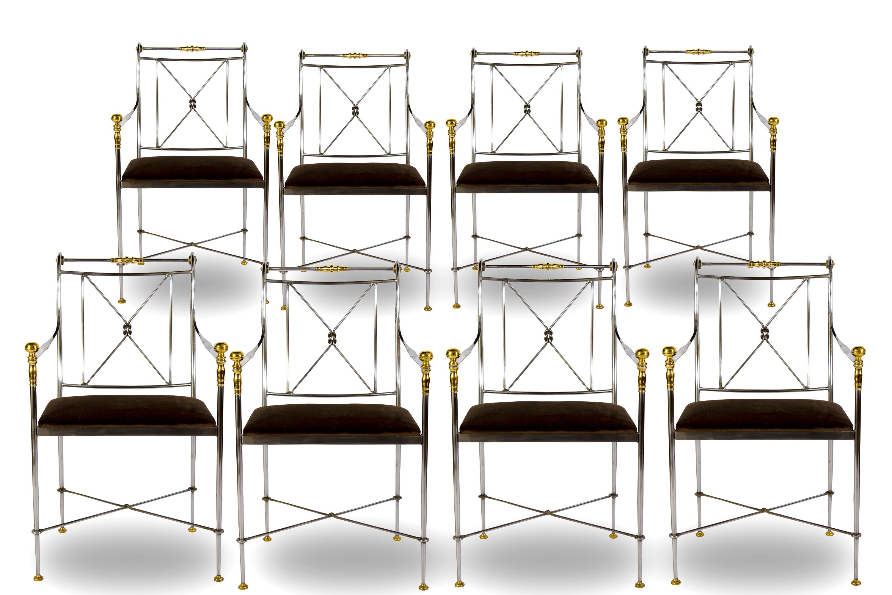 A pair of Italian steel and brass armchairs with dark velvet seats.
Made in Italy and featuring polished steel, solid cast brass made by Orlandi . 
Each chair has been masterfully welded, crafted, absolutely wonderful proportions and is