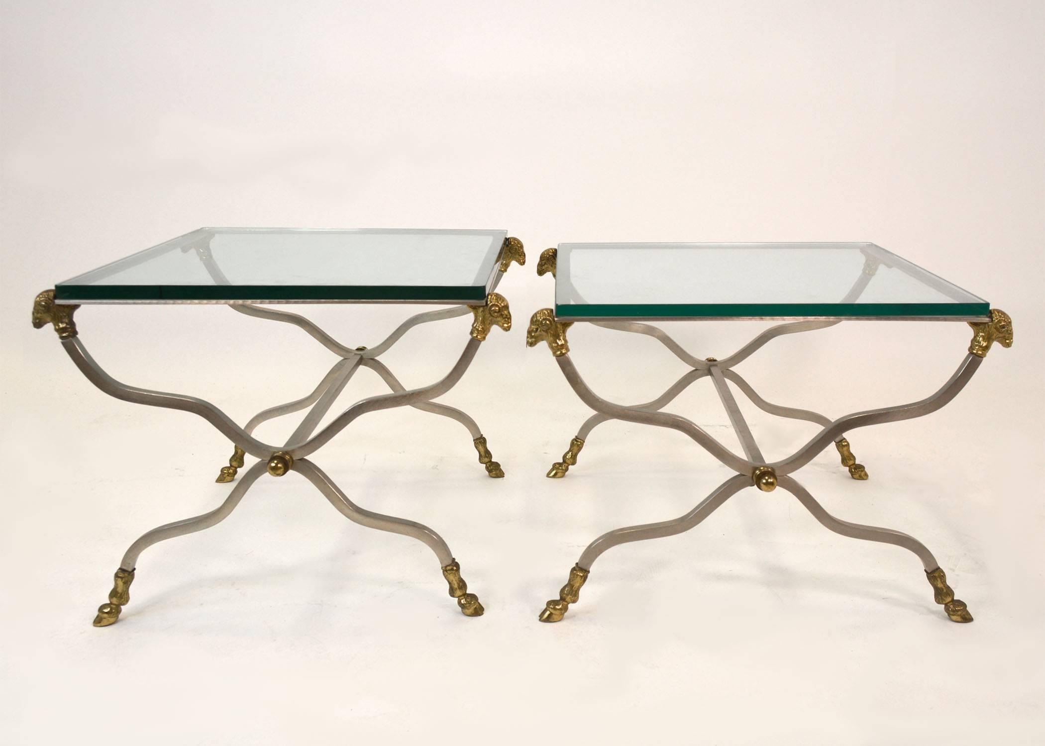 A good pair of Italian steel and brass side tables with thick glass tops. Rams head and hoof mounts, In the style of Maison Jansen. Marked 