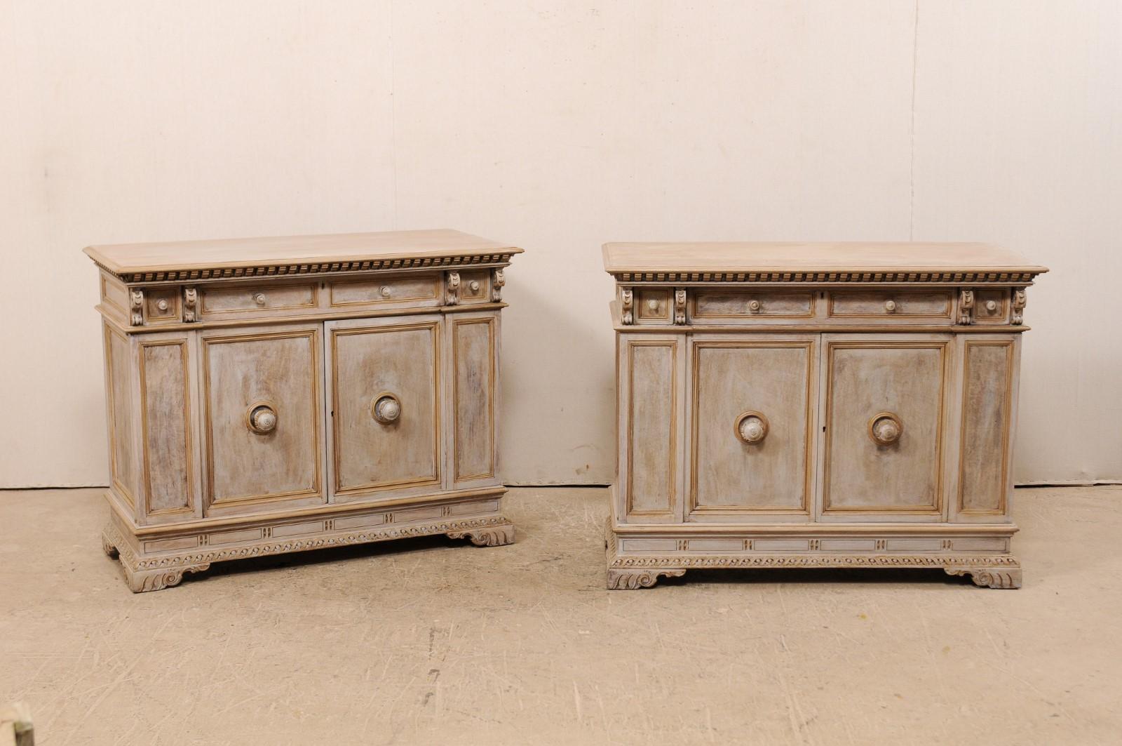 A pair early 20th century, nicely detailed Italian inspired, American made cabinets by furniture makers Henry Fuldner & Sons, NY. This pair of antique Italian style buffet cabinets each feature rectangular-shaped tops with a carved dentil molded